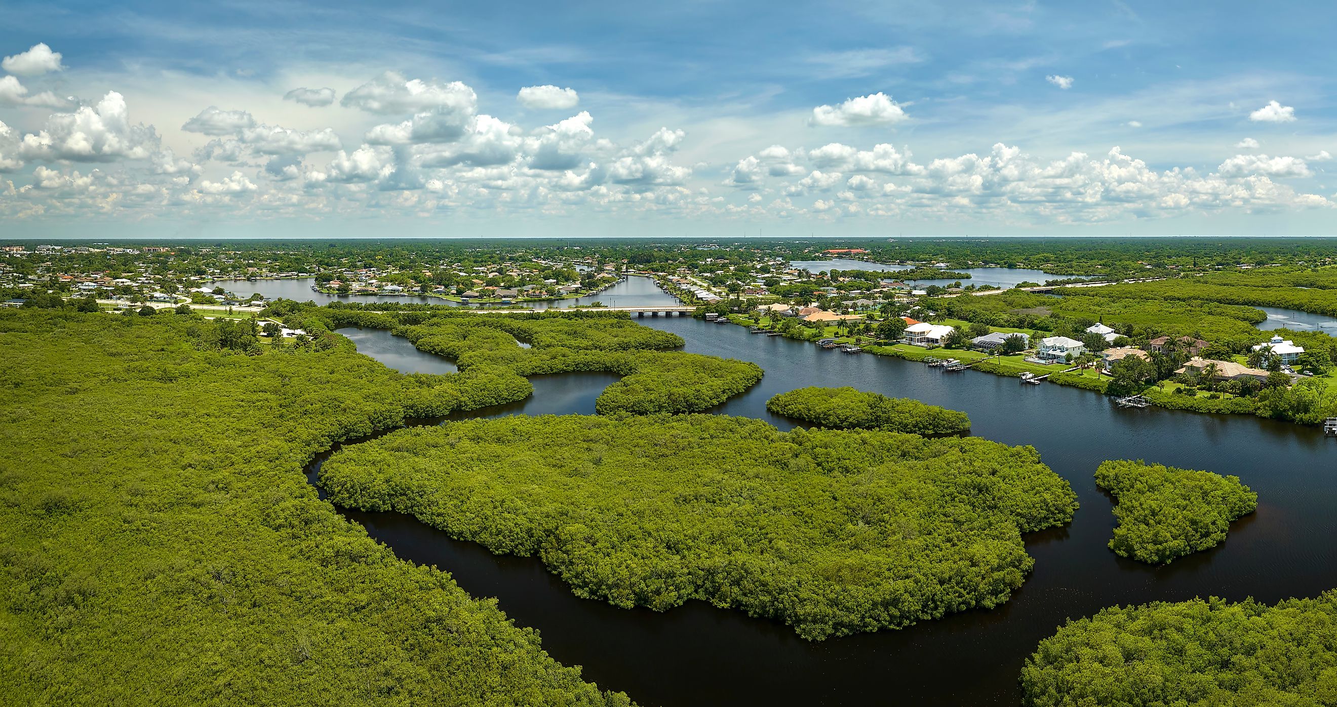 Aerial view of the Everglades swamp and rural private houses.