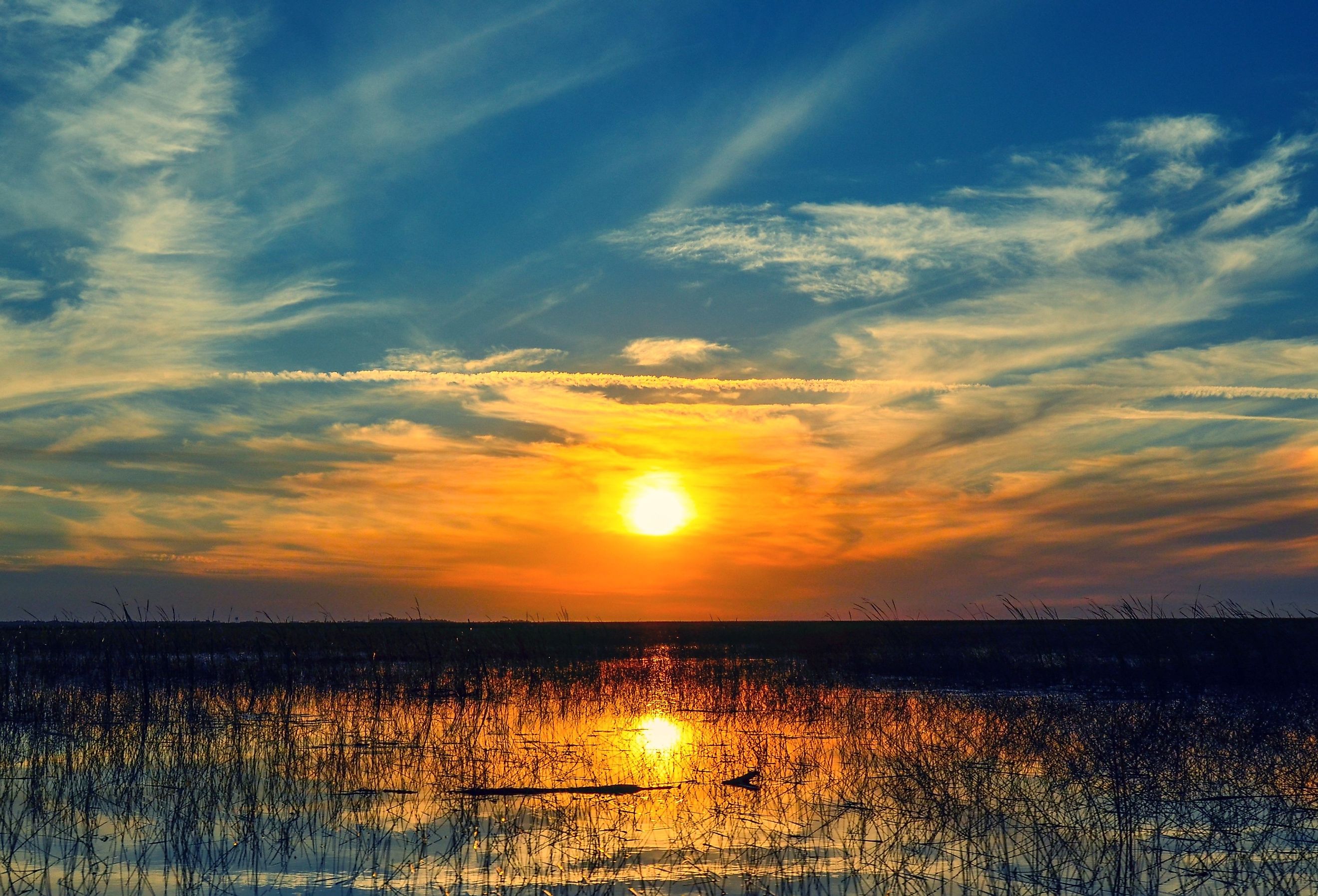 Sunset over the waters of Lake Okeechobee in Florida.