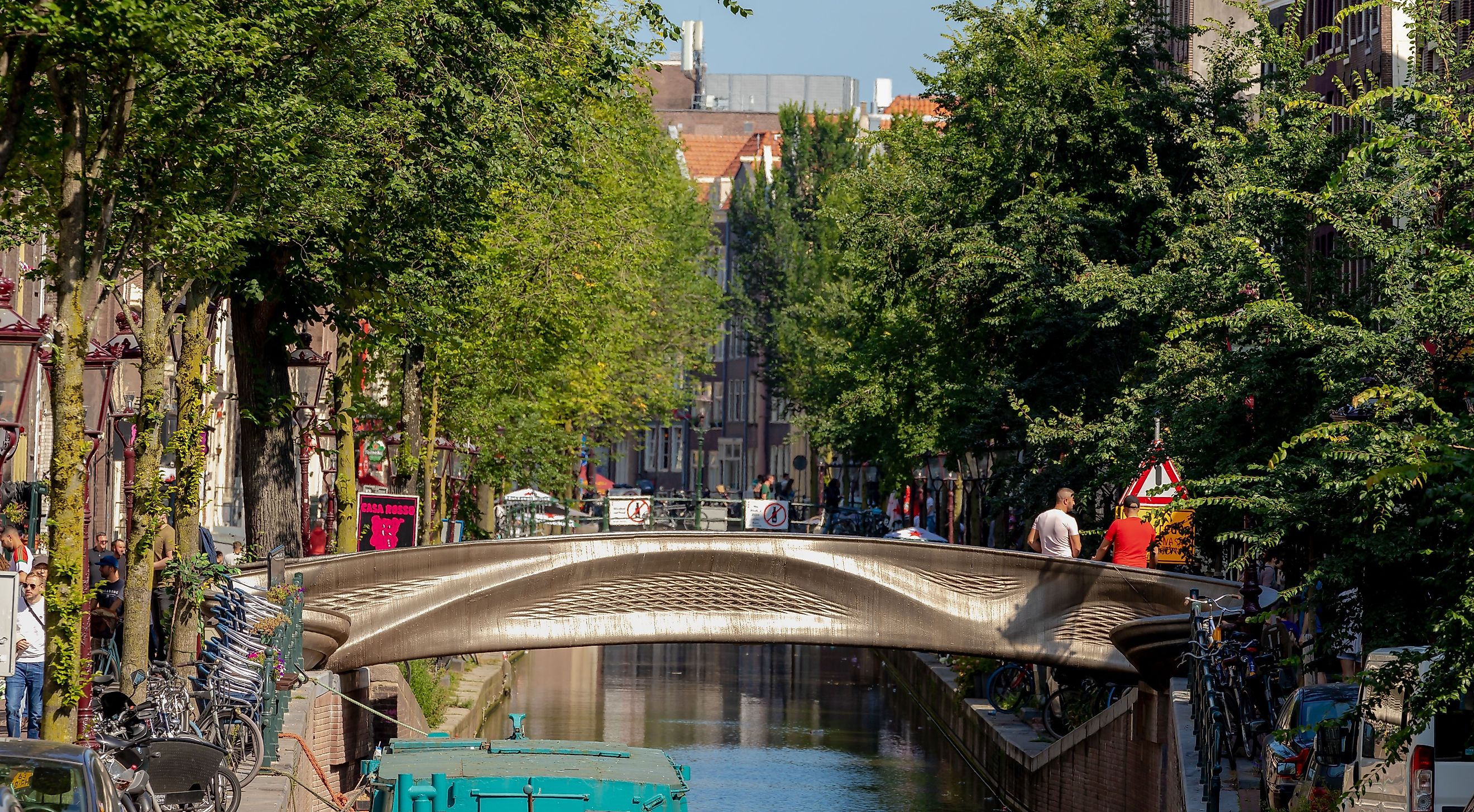 Summer cityscape with architecture traditional canal houses, 3D-printed steel bridge, Red light district, Stoofsteeg, Oudezijds Achterburgwal, Holland, via Wut_Moppie / Shutterstock.com