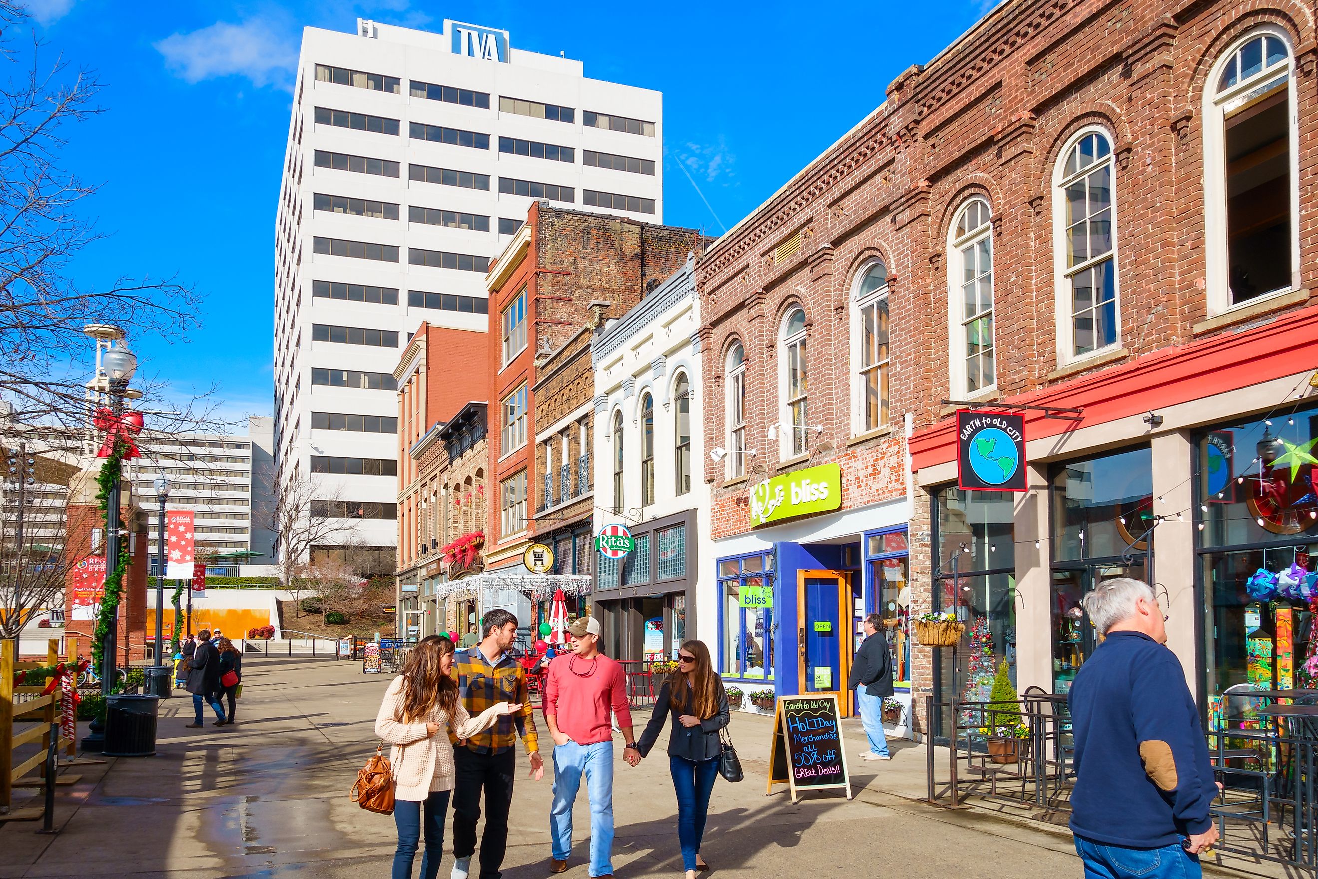 Knoxville, Tennessee: Pedestrians walk past colorful restaurants, bars and businesses on Market Square in downtown Knoxville, Tennessee, via benedek/iStock.com