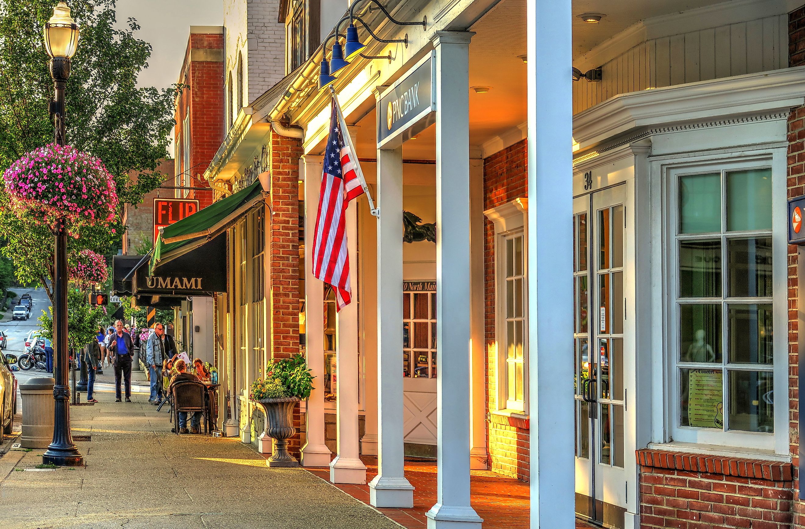 PNC Bank and people dining at outdoor sidewalk seating at Umami on Main Street in Chagrin Falls, Ohio, a beautiful small town. Editorial credit: Lynne Neuman / Shutterstock.com