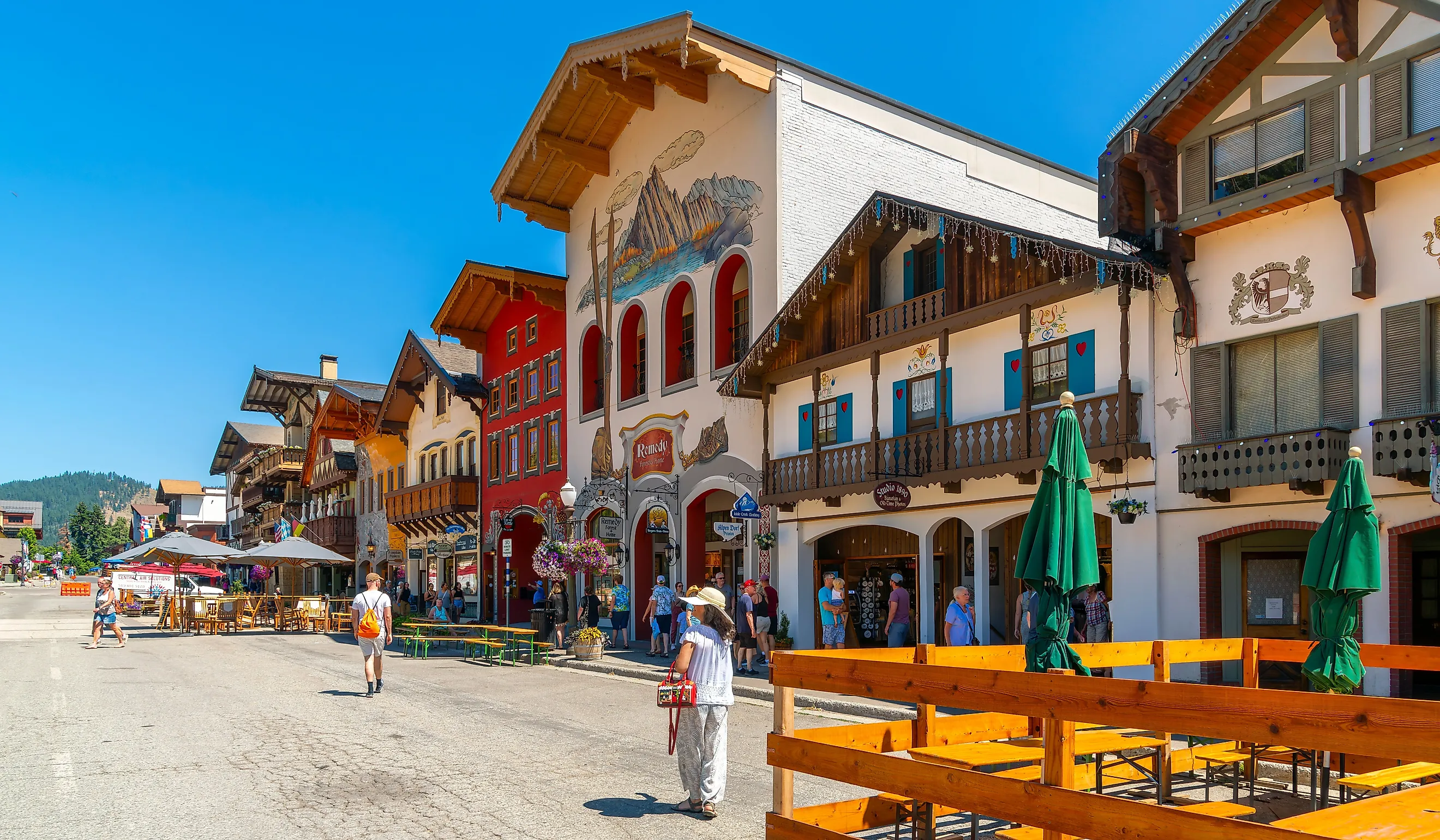 Shops and sidewalk cafes line the quaint Bavarian themed main street of the tourist resort town of Leavenworth. Editorial credit: Kirk Fisher / Shutterstock.com