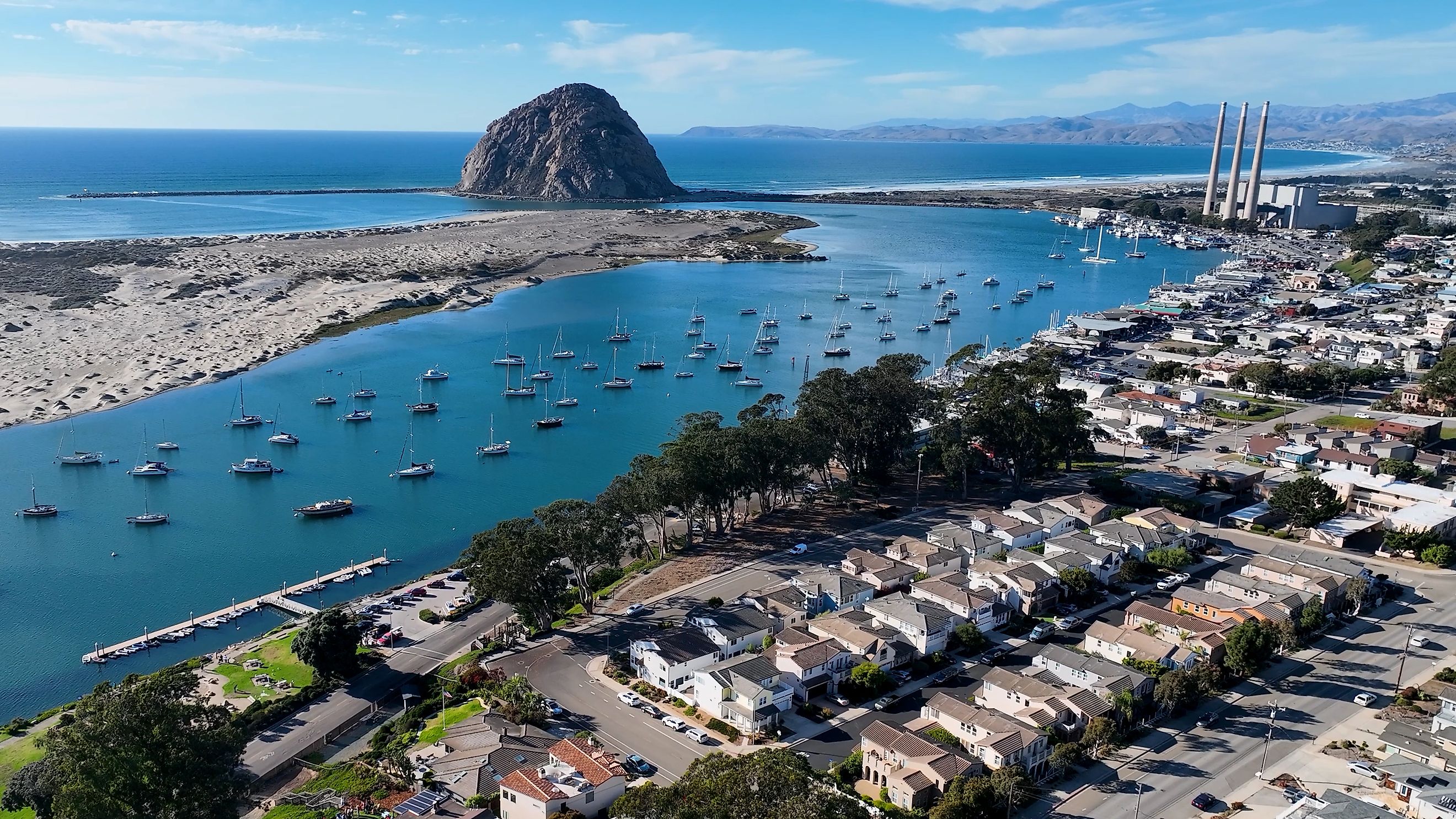 Aerial view of the town and massive rock formation along the coast in Morro Bay, California. Editorial credit: ByDroneVideos / Shutterstock.com