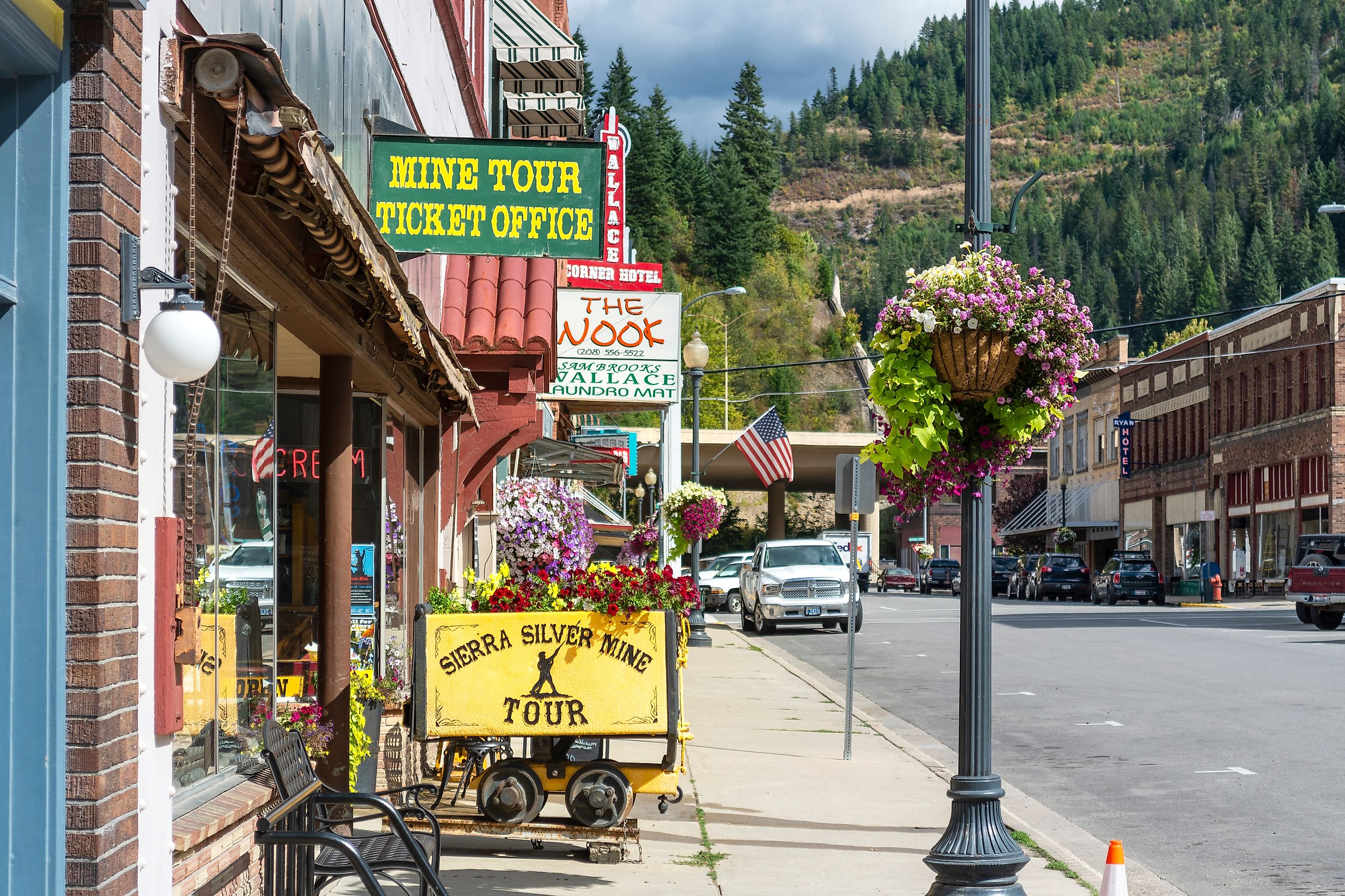 General view of the Sierra Silver Mine tour sign on a sidewalk in the historic mountain town of Wallace, Idaho