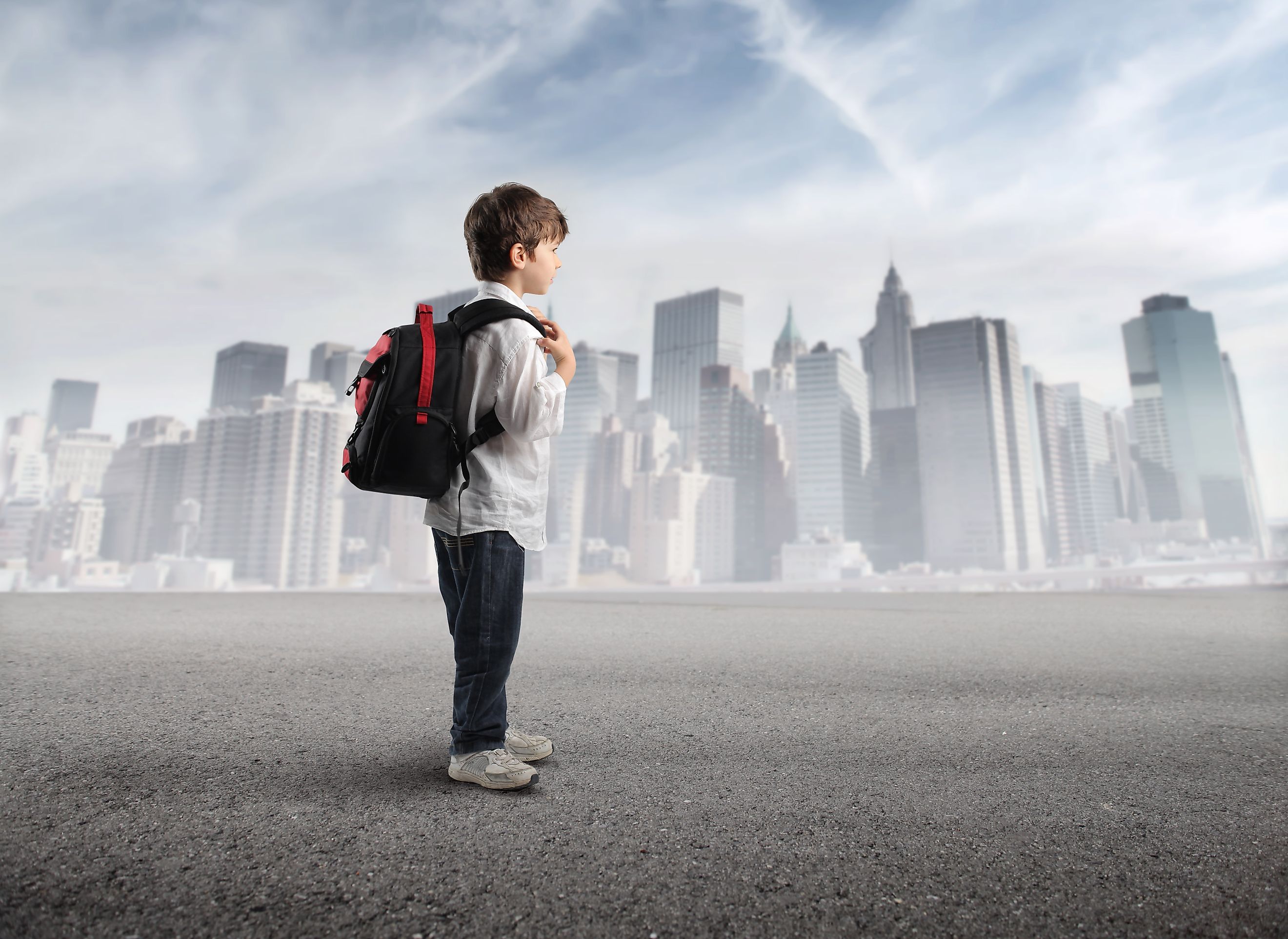 American child with backpack on his back