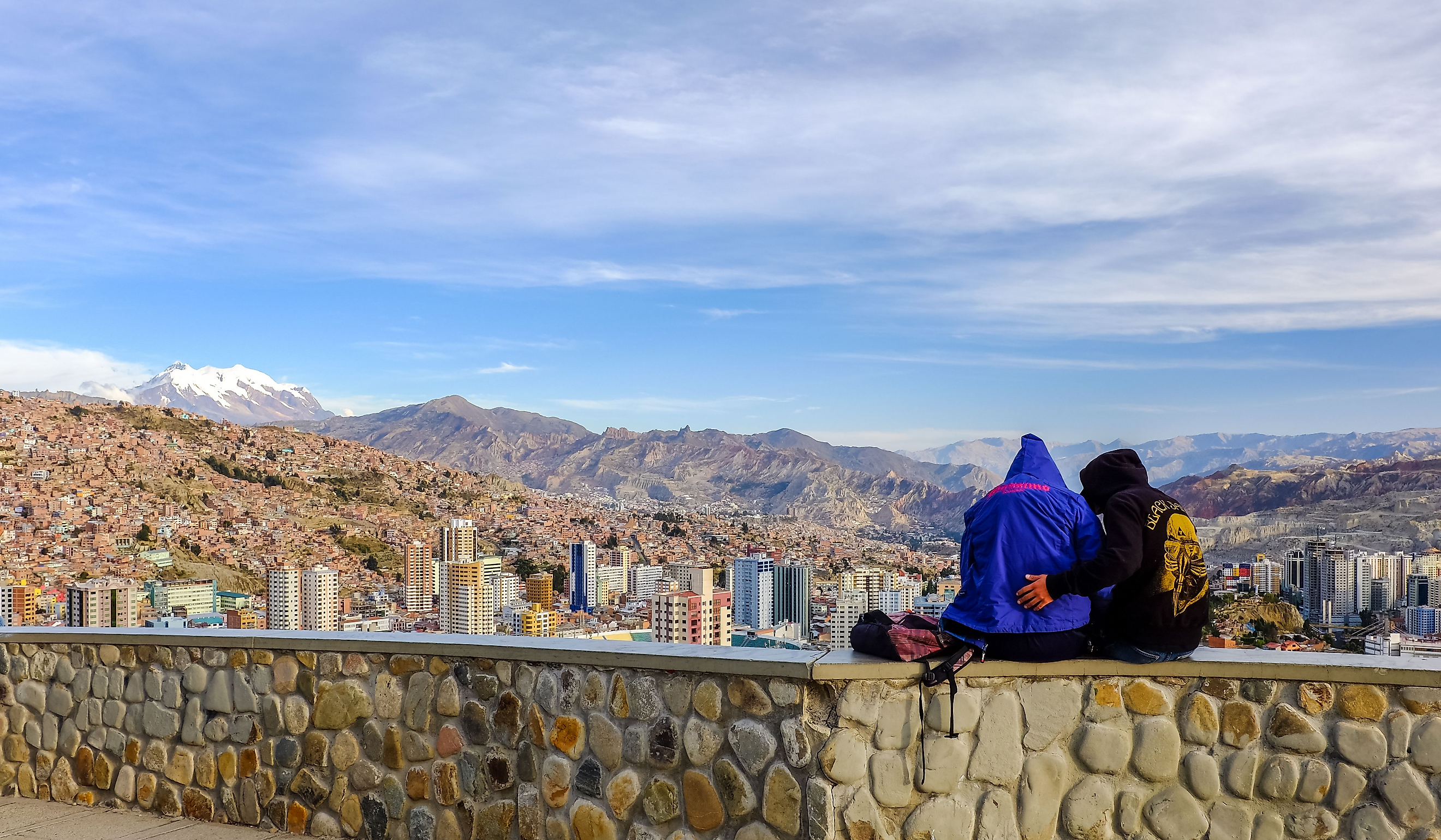 People enjoying the cityscape view from Mirador Killi Killi in La Paz, Bolivia. Image Credit ichywong via Shutterstock.