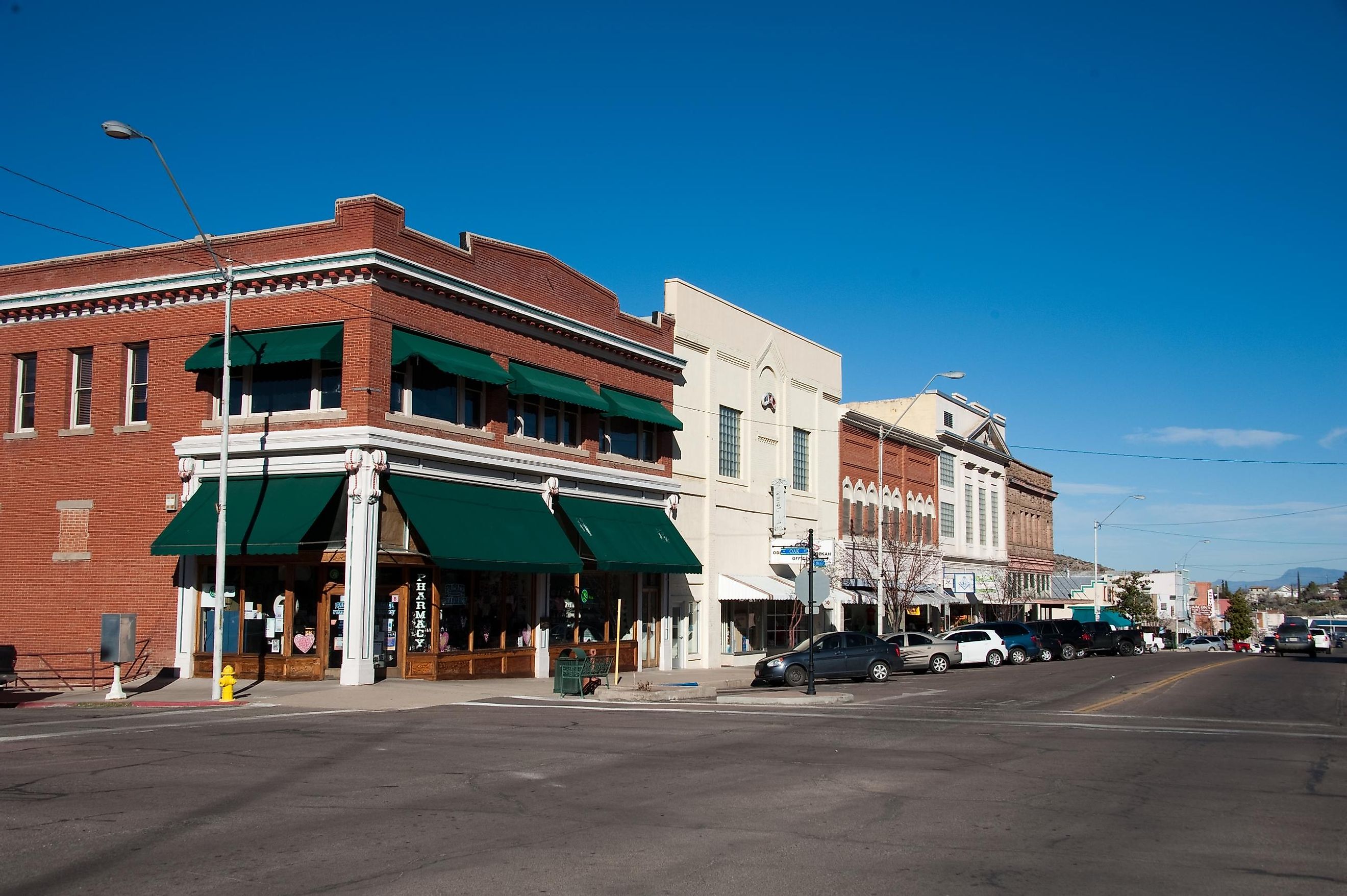 Corner of Broad St. and Oak St. Businesses include Palace Pharmacy and the Old Odd Fellows Lodge.