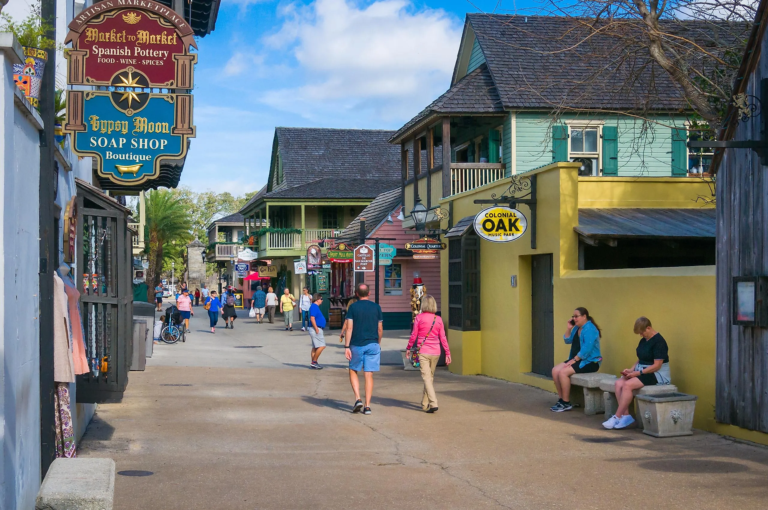 A few tourists walk along St. George street in St. Augustine, Florida, via KenWiedemann / iStock.com