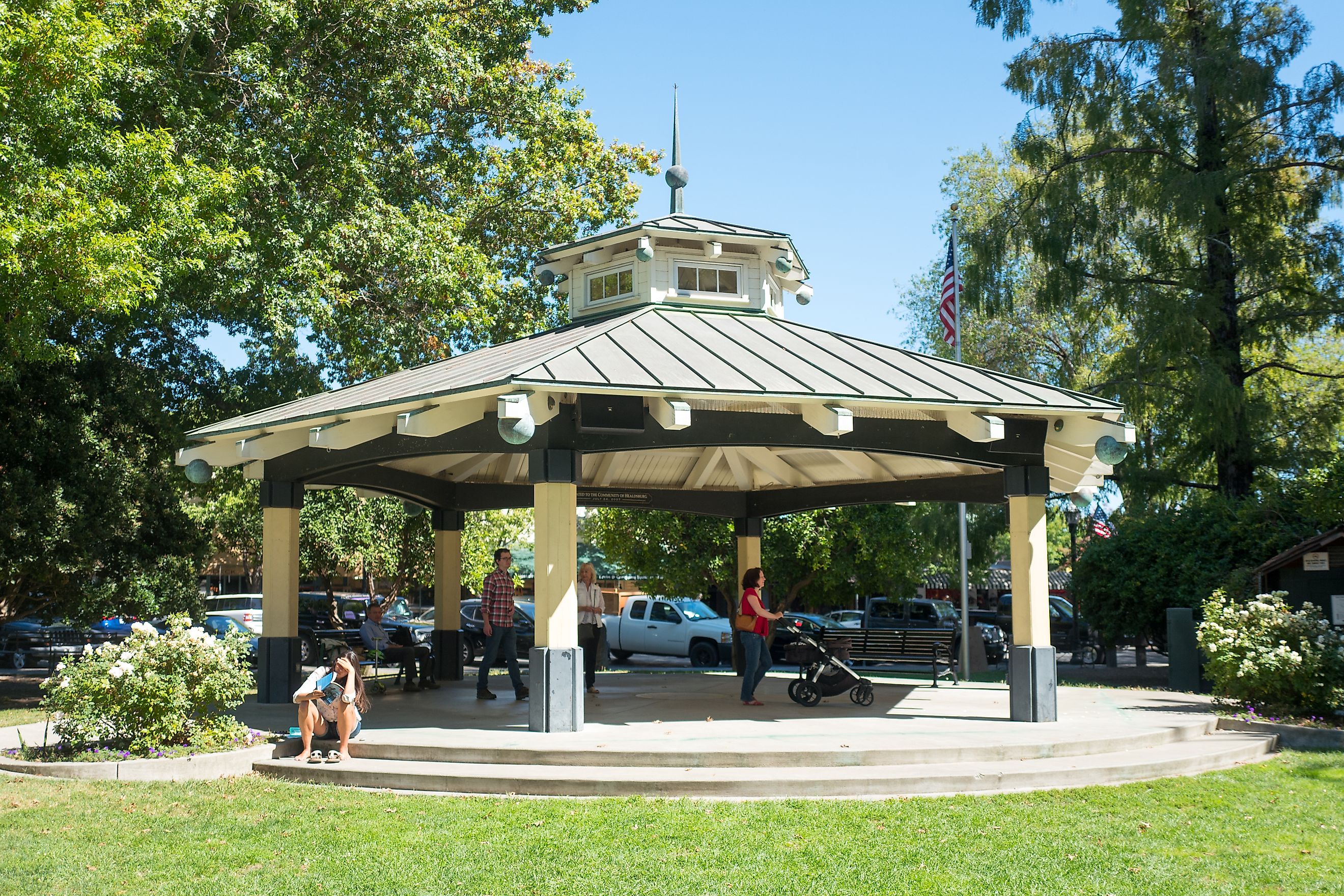 People walk through performance pavilion in the central square in the Sonoma County wine country town of Healdsburg, California