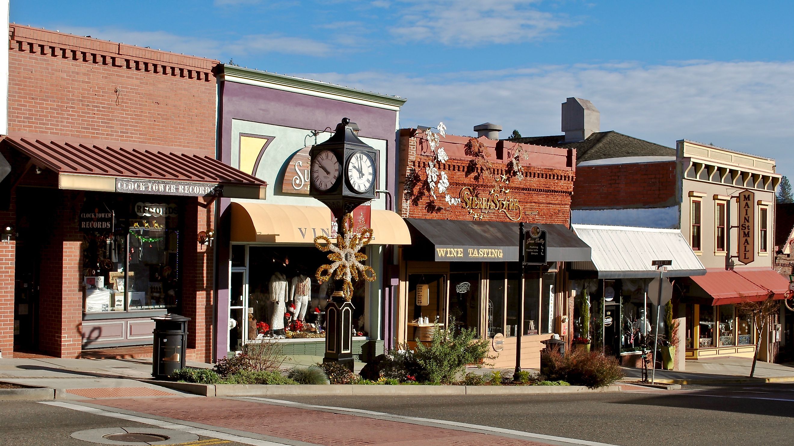 Grass Valley, California, USA - 2019: Main Street with a clock tower, Clock Tower Records, Sierra Star Winery, and Pete's Pizza. Editorial credit: EWY Media / Shutterstock.com