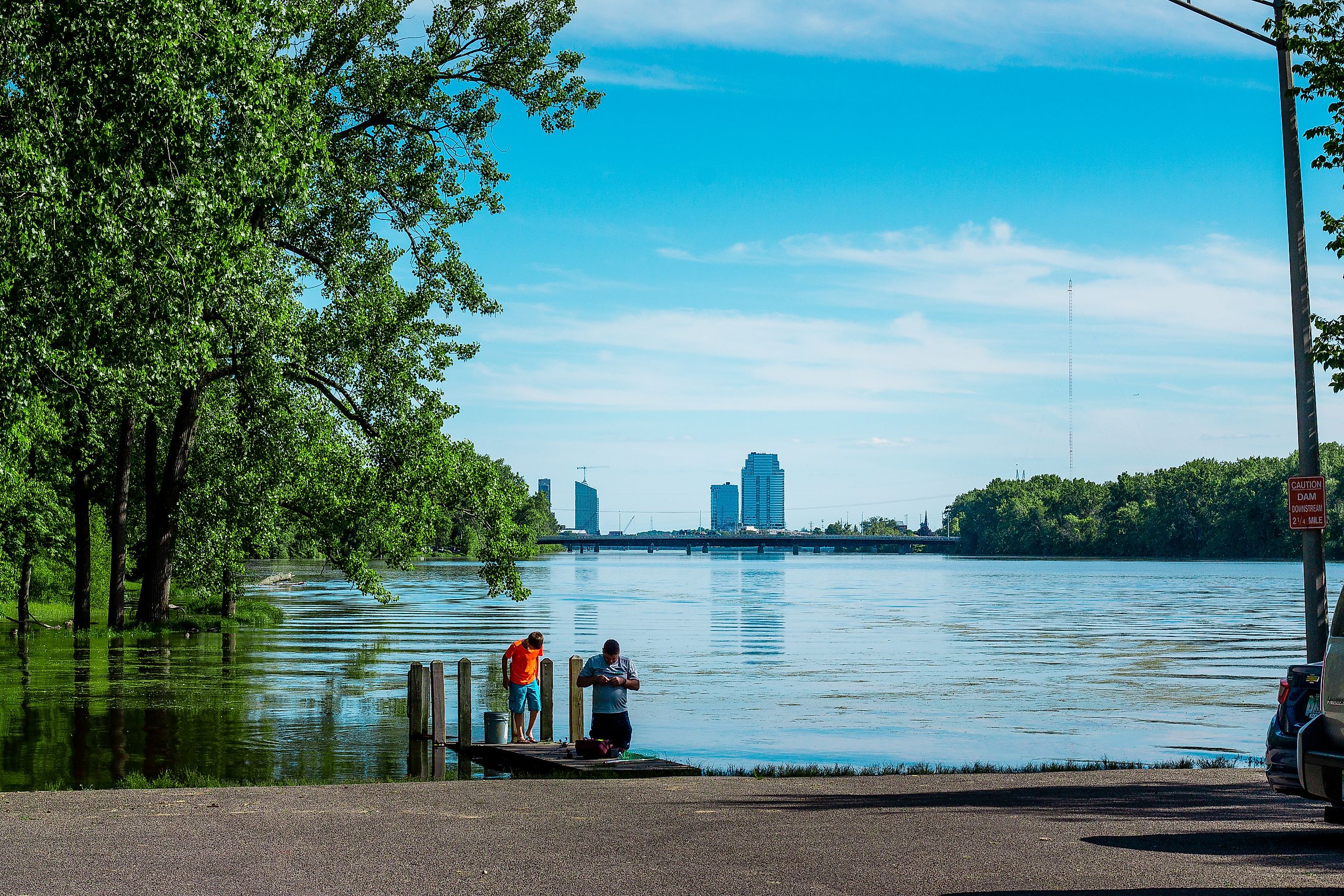 People fishing in the Grand River in Grand Rapid. Editorial credit: Michael Deemer / Shutterstock.com. 