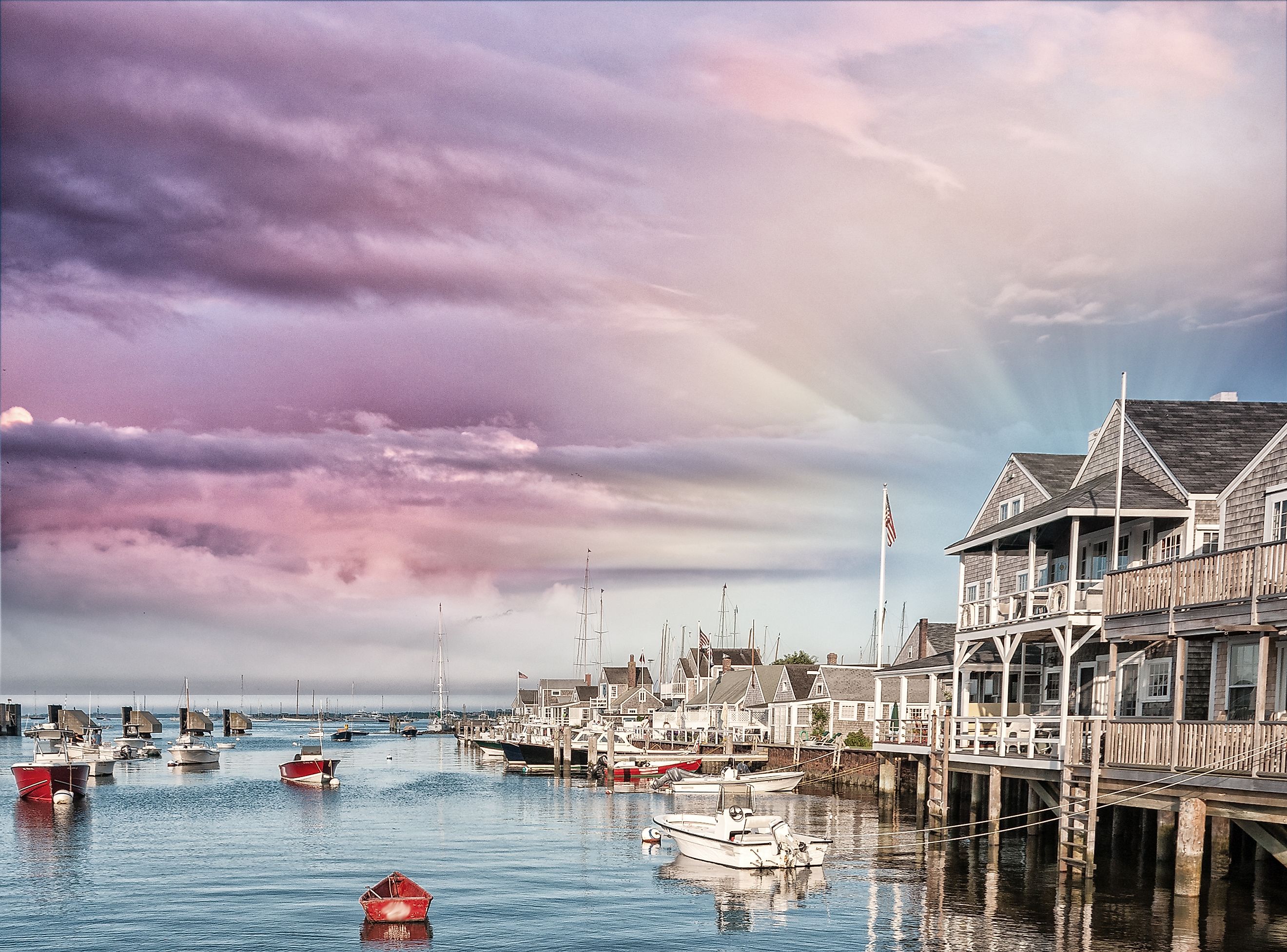 Beautiful homes of Nantucket, Massachusetts, USA. Houses over water at dusk.