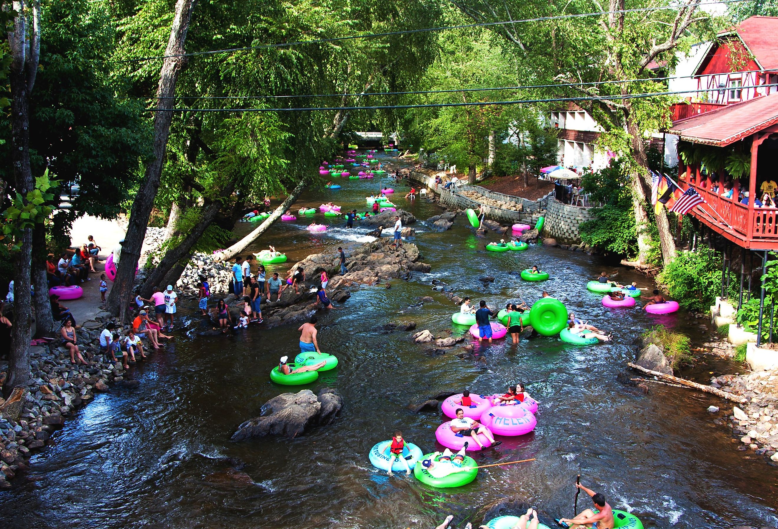 Tourists tubing the lazy river Chattahoochee in the summer in Helen, Georgia. Image credit Paul Hakimata Photography via Shutterstock