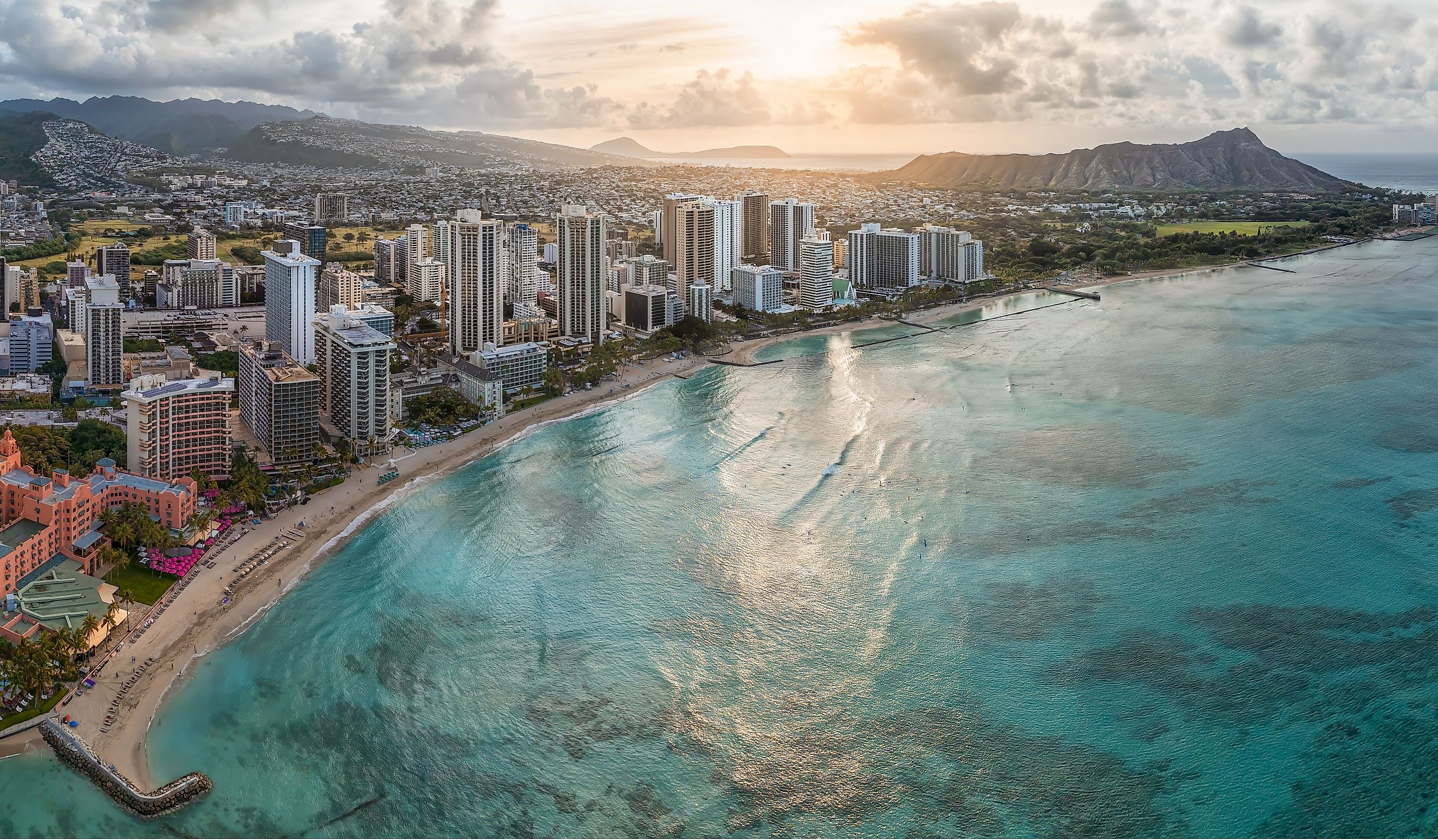 Sunrise over Honolulu with Waikiki Beach in the foreground.