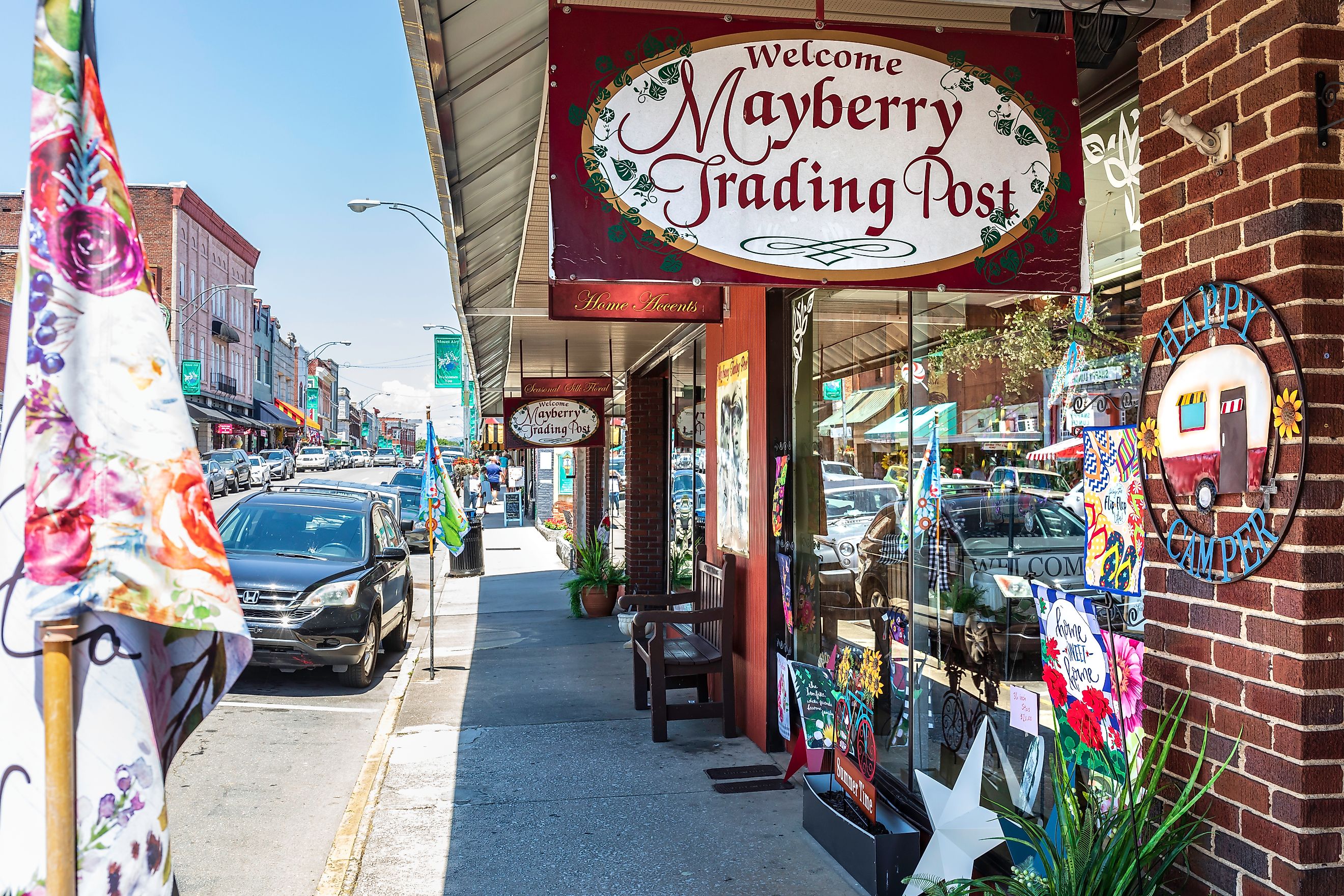 Mount Airy, North Carolina: A view down busy Main Street past the colorful Mayberry Trading Post, via J. Michael Jones / iStock.com