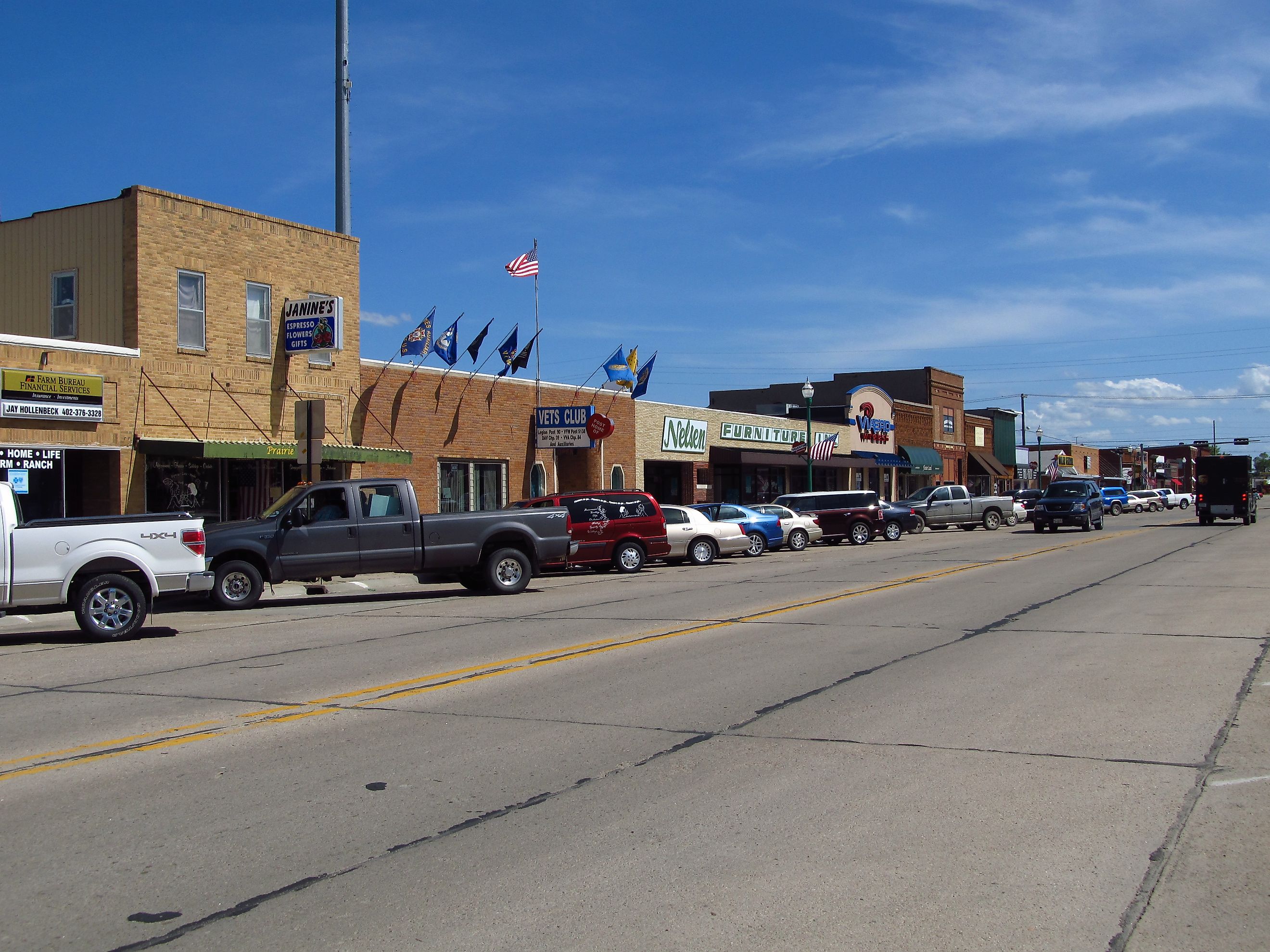 Street view of downtown Valentine, Nebraska. Editorial Credit: Jasperdo via Flickr: https://flickr.com/photos/mytravelphotos/14991187565/in/photolist-oQHKM8-oQFWsY-p1xV3f-2mjF5kf-PyEKeW-oWYhkm-oxohww-pebTQn-oPT3Ya-oPRdYG-Pawpcb-oxoW8v-oxogvH-oydWhp-oxoj1o