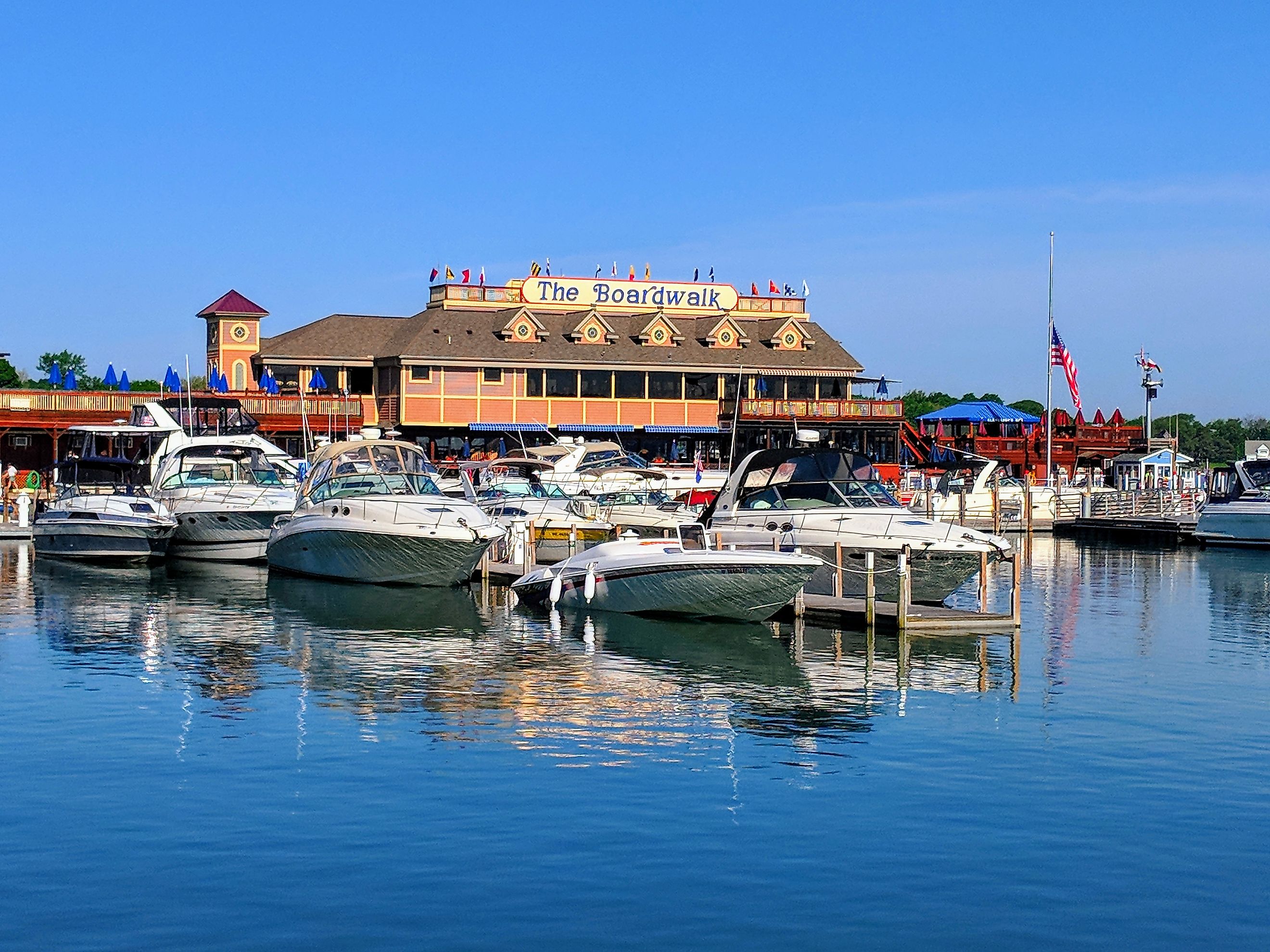 Put-in-bay, Ohio: Boats tied up at A-Dock with the famous Boardwalk restaurant in the background, via LukeandKarla.Travel / Shutterstock.com