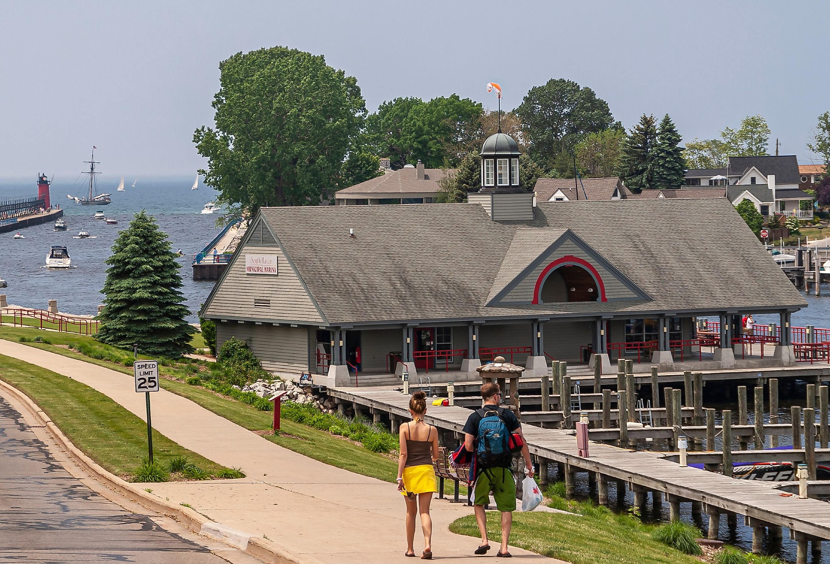 Municipal Marina building built on Black River emptying in Lake Michigan under blue sky in South Haven, Michigan.