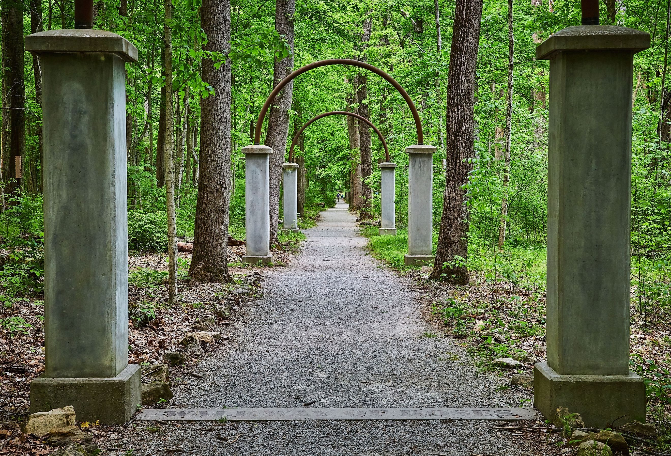 Row of concrete pillars and metal arches on Rose Island, Indiana