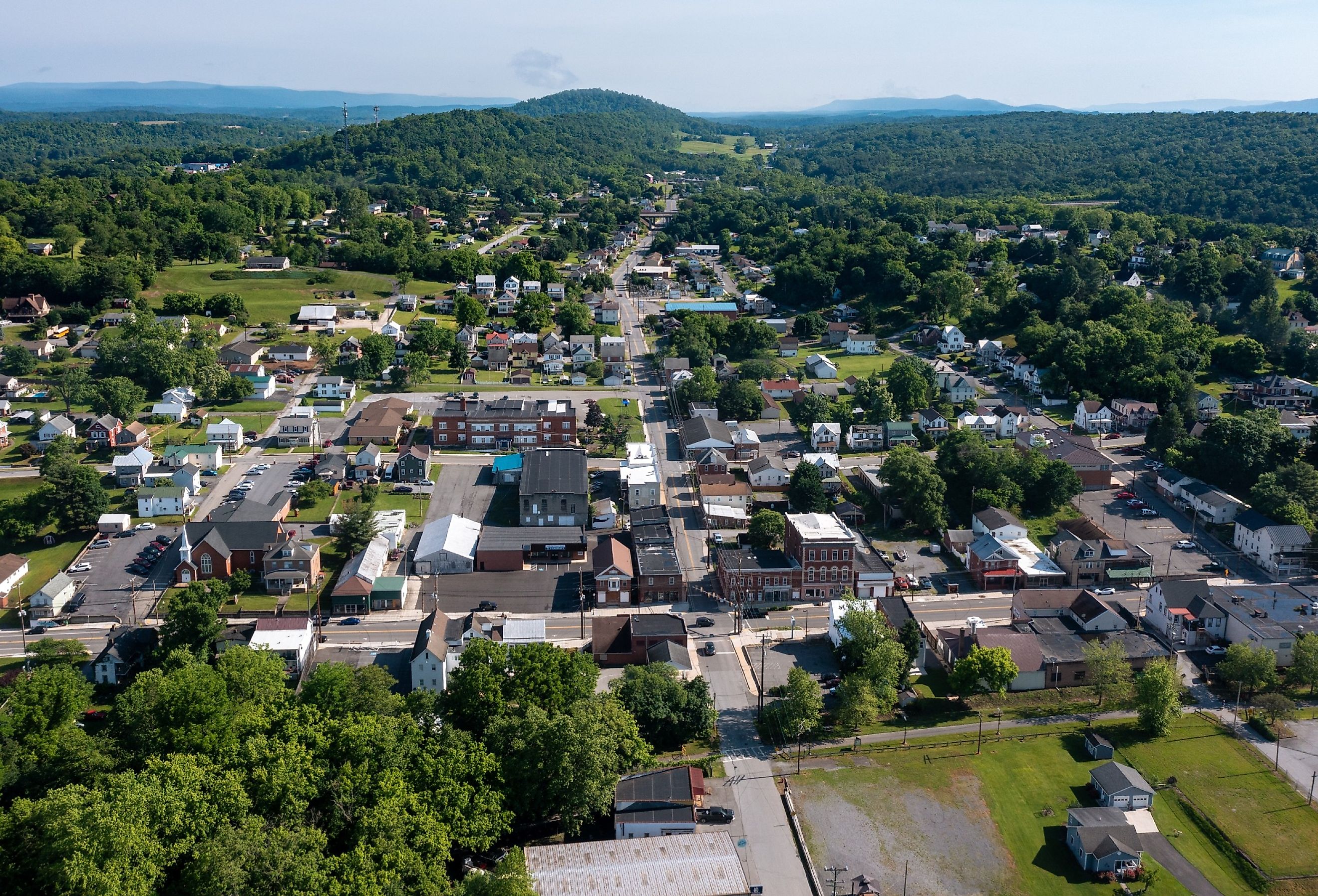 Aerial view of Hancock, Maryland and the forest and mountains near the Potomac River.