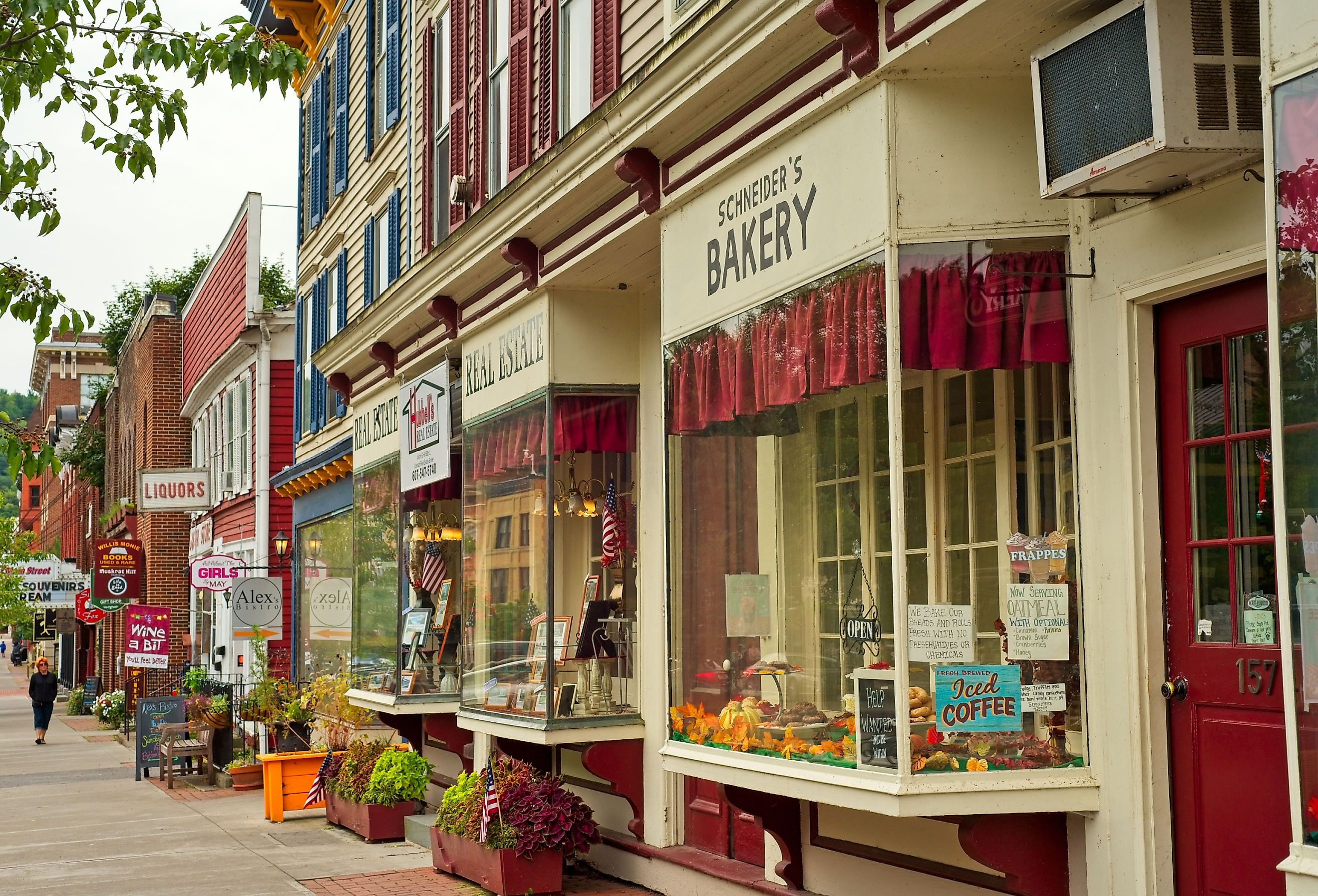 Shops, eateries, and baseball-themed attractions line the sidewalk on Main Street in this charming upstate New York town. Image credit Kenneth Sponsler via Shutterstock.