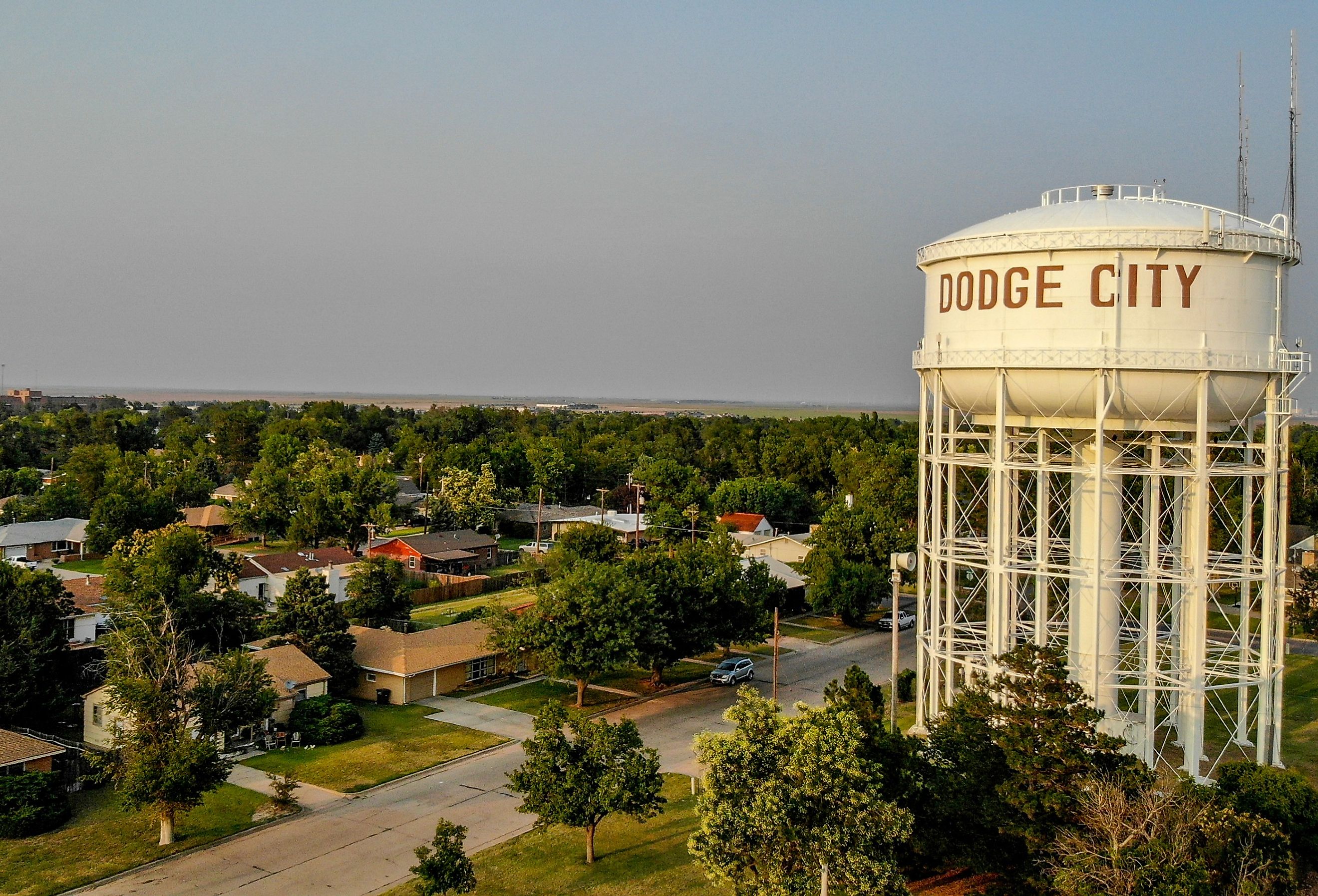 Water tower in downtown afternoon Dodge City, Kansas. Image credit Eduardo Medrano via Shutterstock