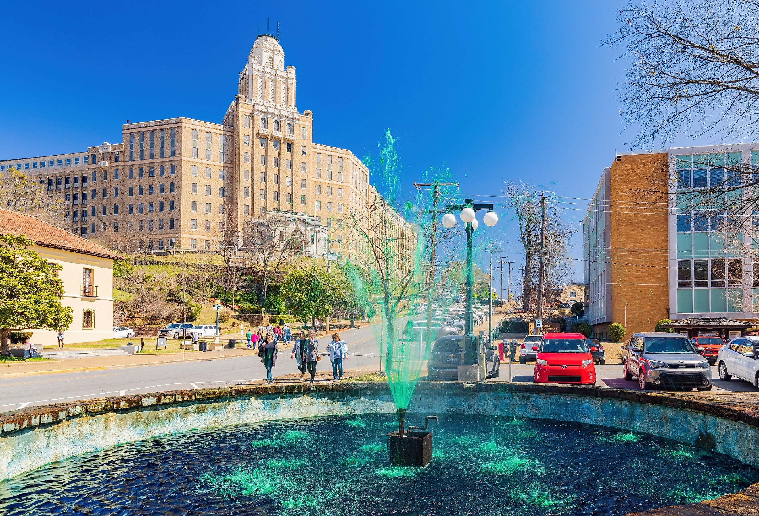 Sunny view of the fountain with green water for St Patrick's Day in Bill Clinton Park, Hot Springs, Arkansas. Image credit Kit Leong via Shutterstock