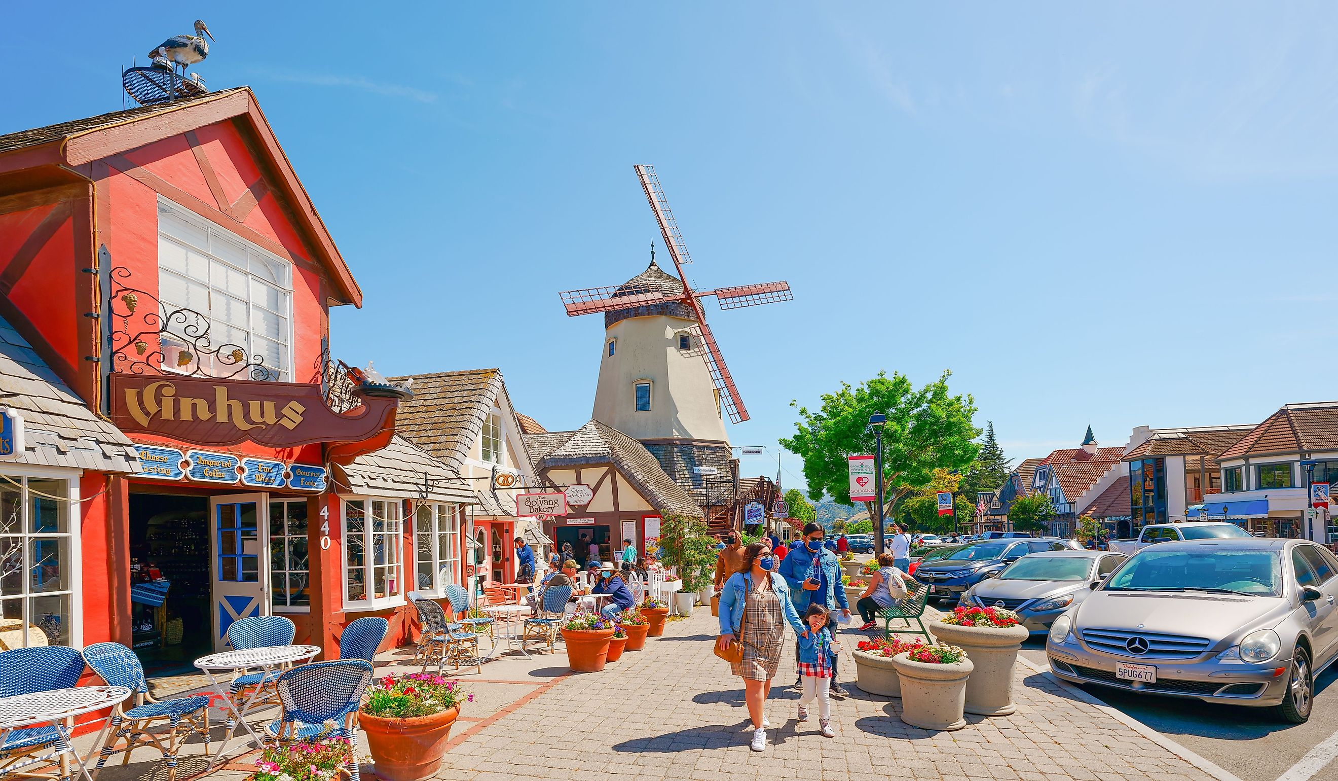 Main street, street view, and tourists in Solvang, beautiful small town in California. Editorial credit: HannaTor / Shutterstock.com