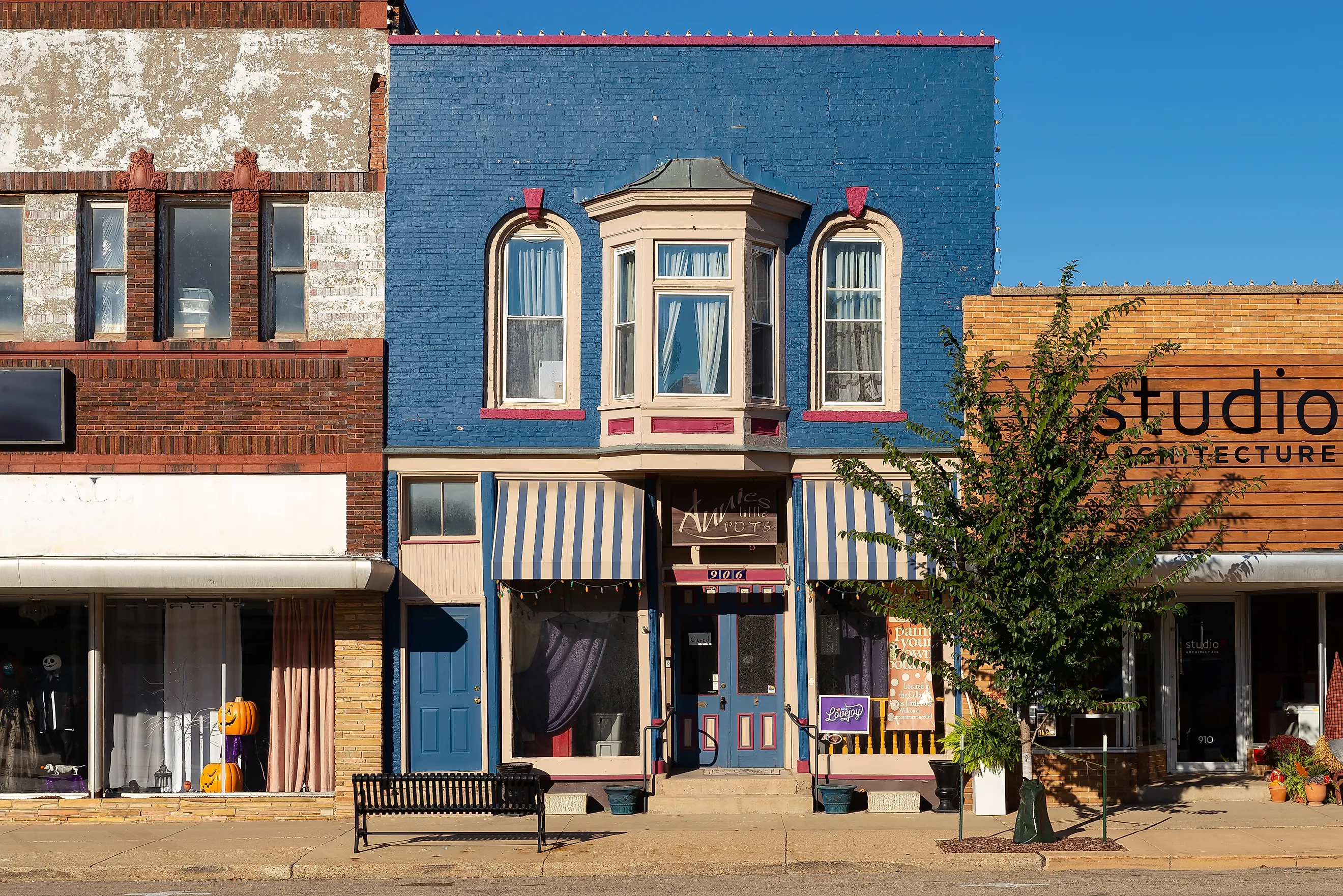 Colorful old brick buildings and storefronts in downtown Princeton, Illinois, via EJ_Rodriquez / iStock.com