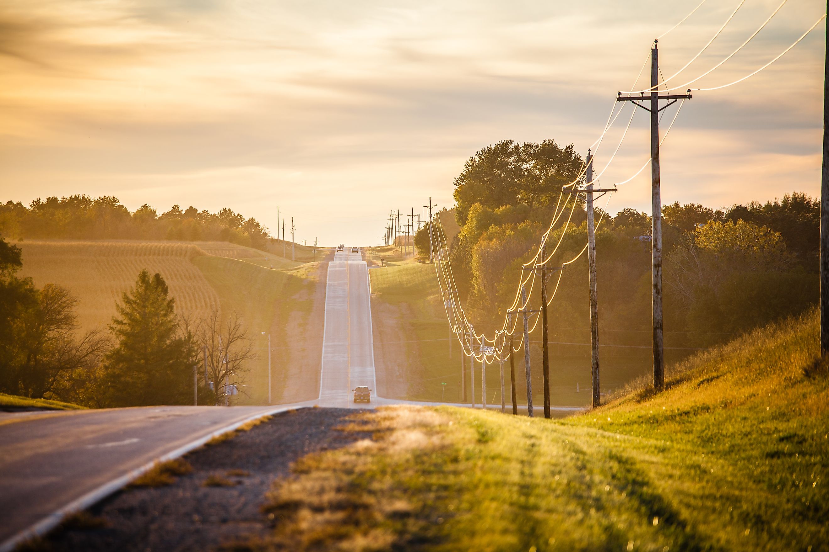 A quiet country road, surrounded by expansive fields in Midwest Nebraska.