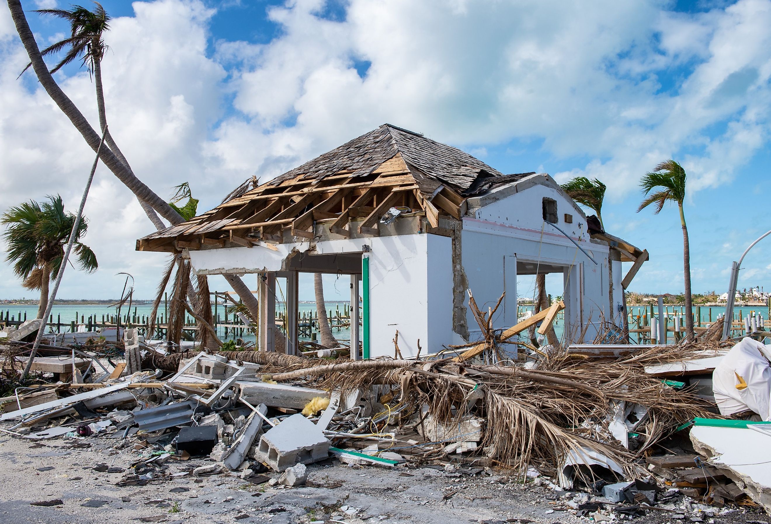 Destruction from hurricane Dorian showing debris and structural damage to buildings and trees. Image credit Paul Dempsey via Shutterstock