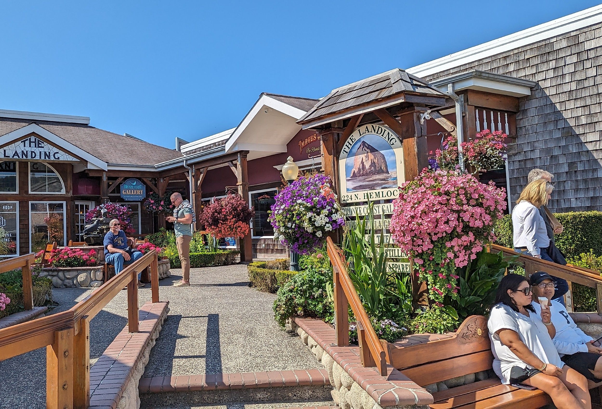 People relaxing in downtown Cannon Beach, Oregon. Image credit quiggyt4 via Shutterstock