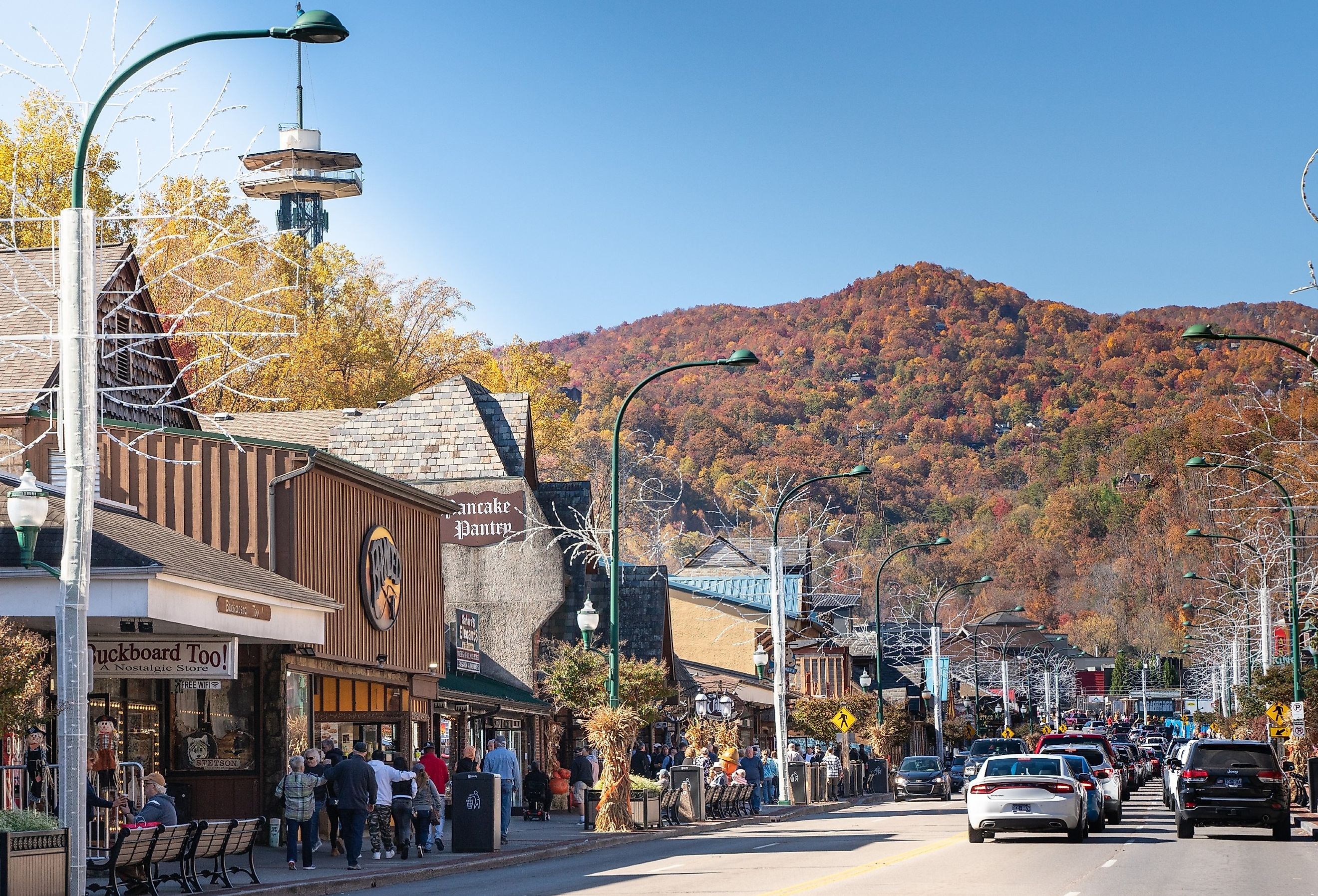 Street view of popular tourist city of Gatlinburg Tennessee in the Smoky Mountains, in autumn. Image credit Little Vignettes Photo via Shutterstock