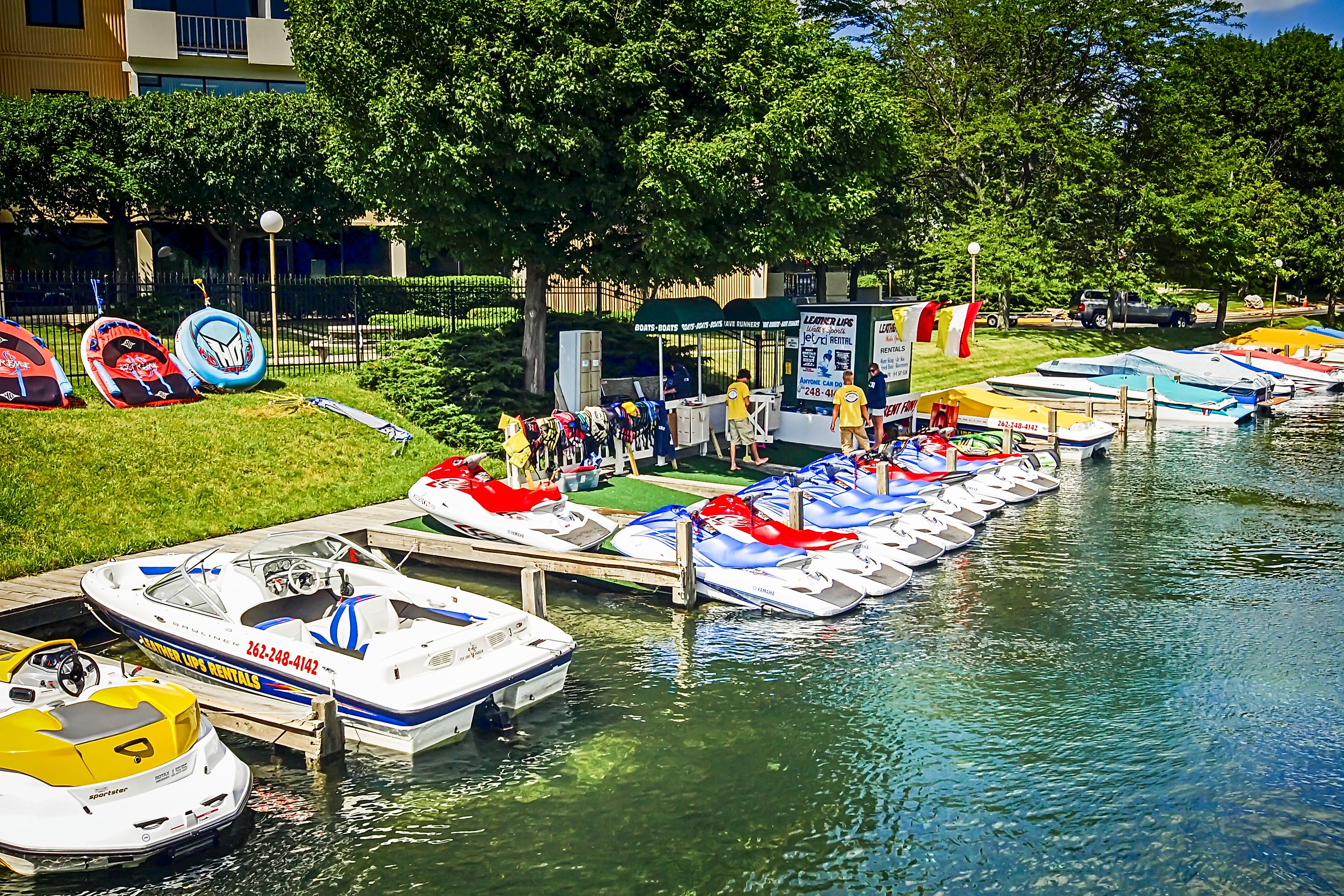 People at a Jetskis rental-shop at Lake Geneva in Wisconsin, via csfotoimages / iStock.com