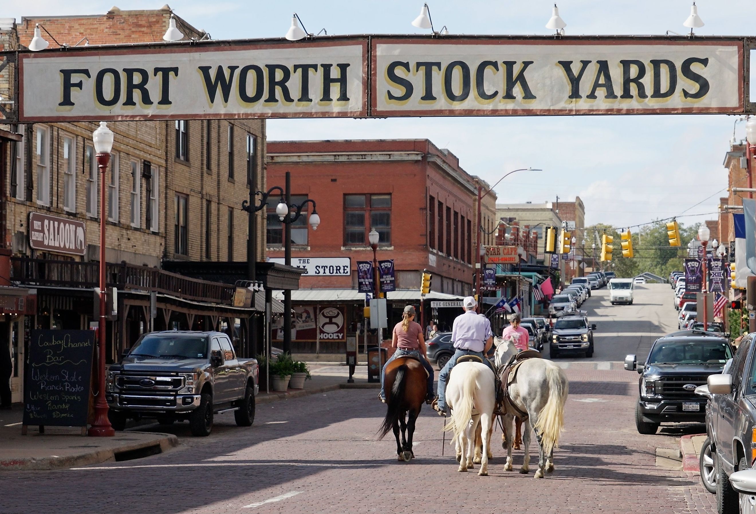 Horseback riding through the Fort Worth Stockyards in Texas. Image credit 4kclips via Shutterstock