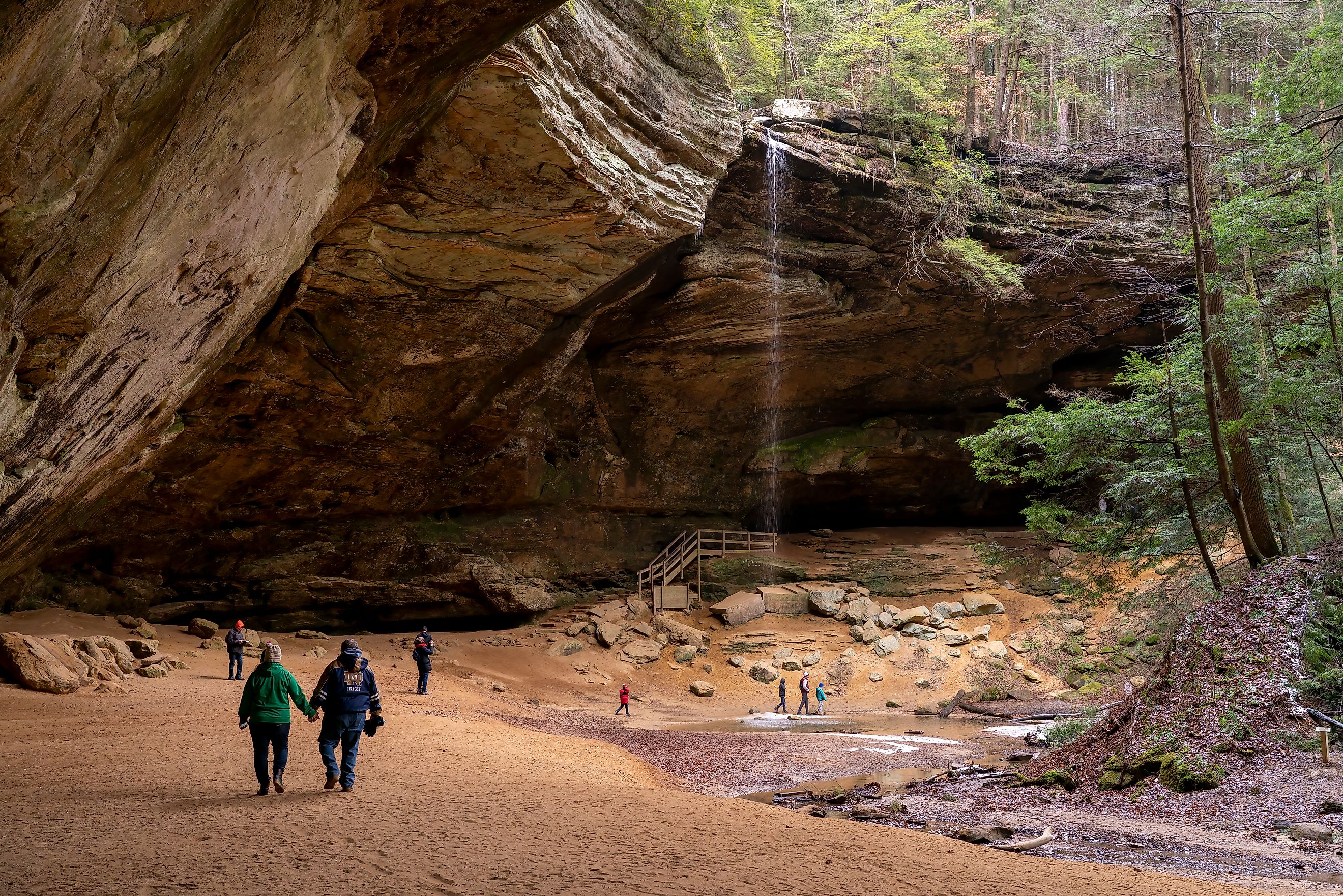 Tourists visit Ash Cave in the Hocking Hills State Park. Editorial credit: arthurgphotography / Shutterstock.com.