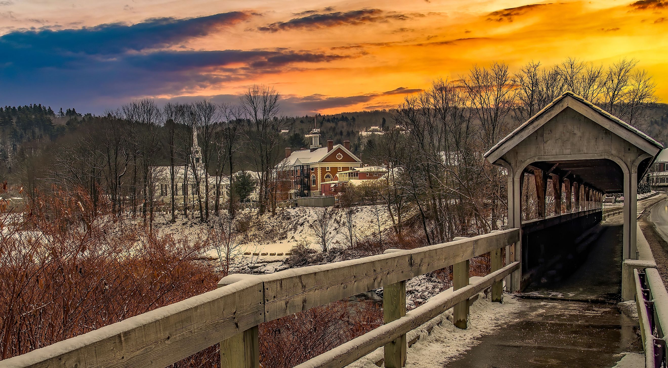 Evening landscape and rustic buildings in the town of Stowe, Vermont.