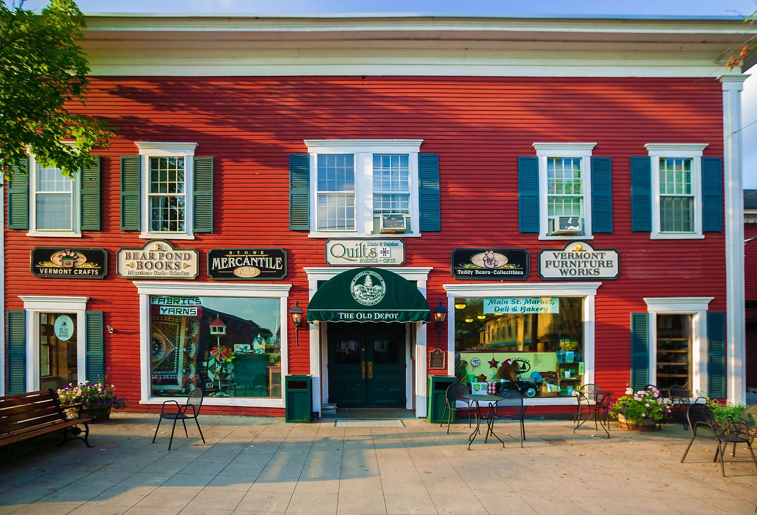 Small storefronts and boutiques in Stowe, Vermont. Image credit Don Landwehrle via Shutterstock.