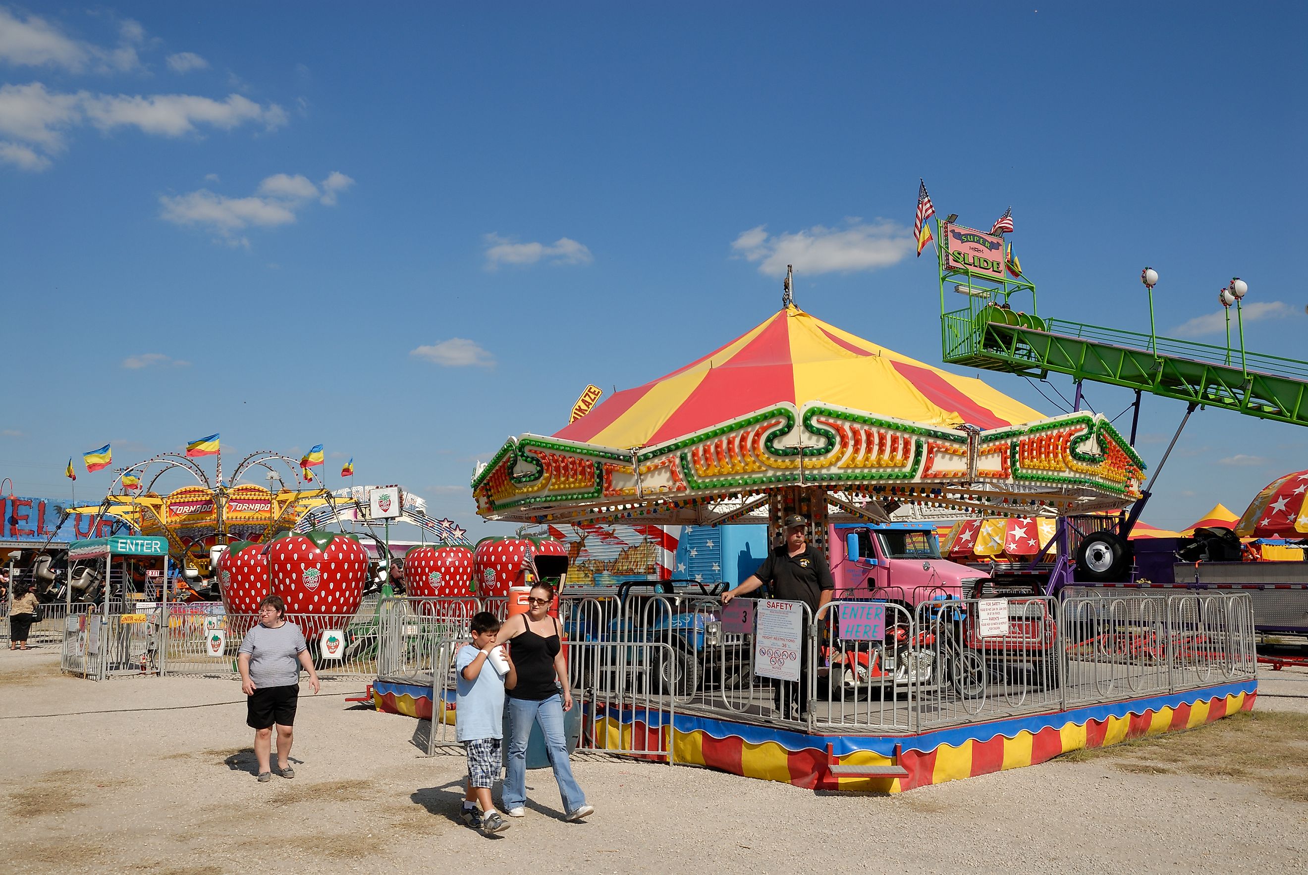 Carousel at the amusement park Beeville, Texas in October, via Philip Lange / Shutterstock.com