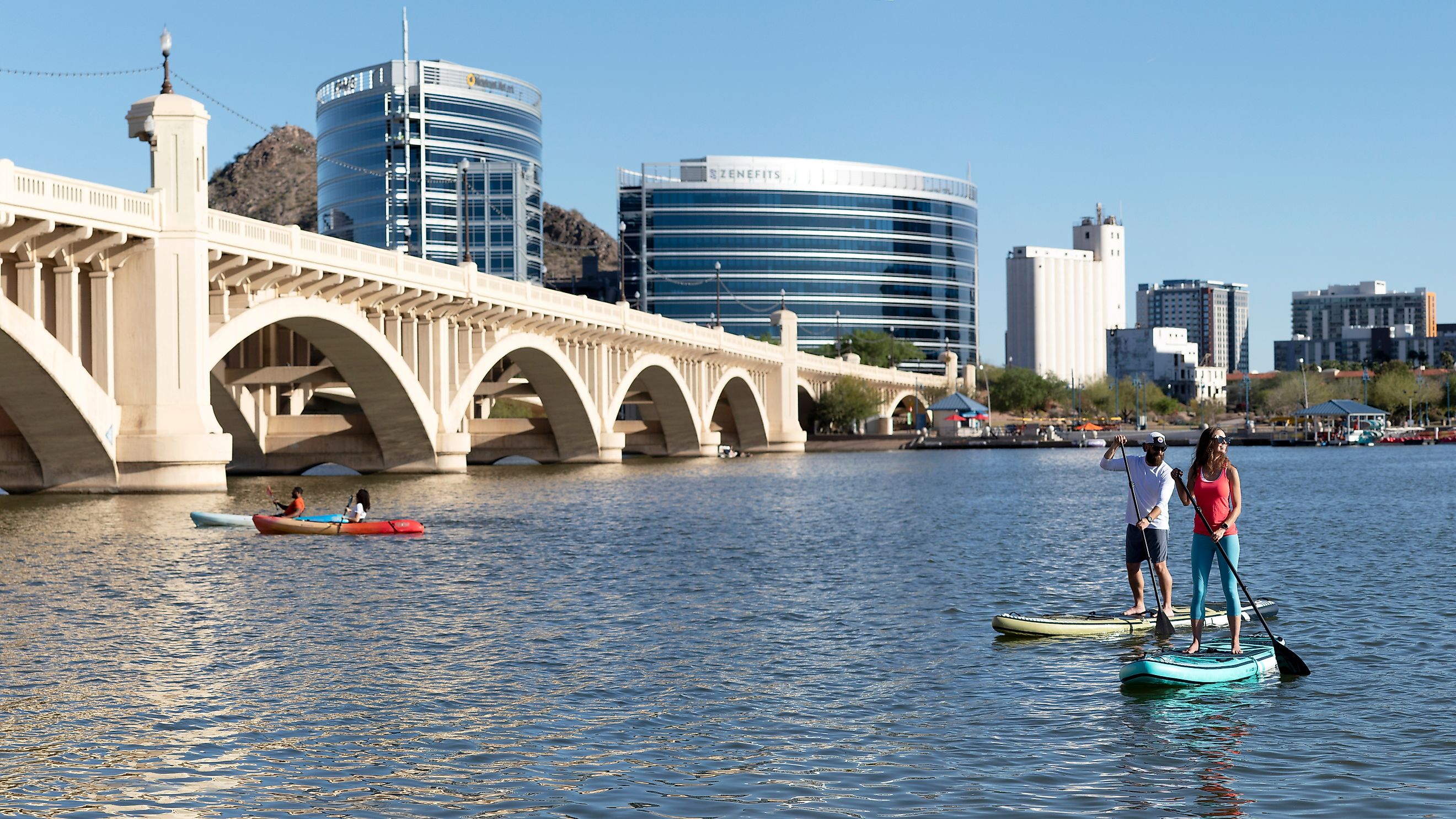 Paddle boarders and kayakers on Tempe Town Lake, Tempe, Arizona, via Cavan-Images / Shutterstock.com