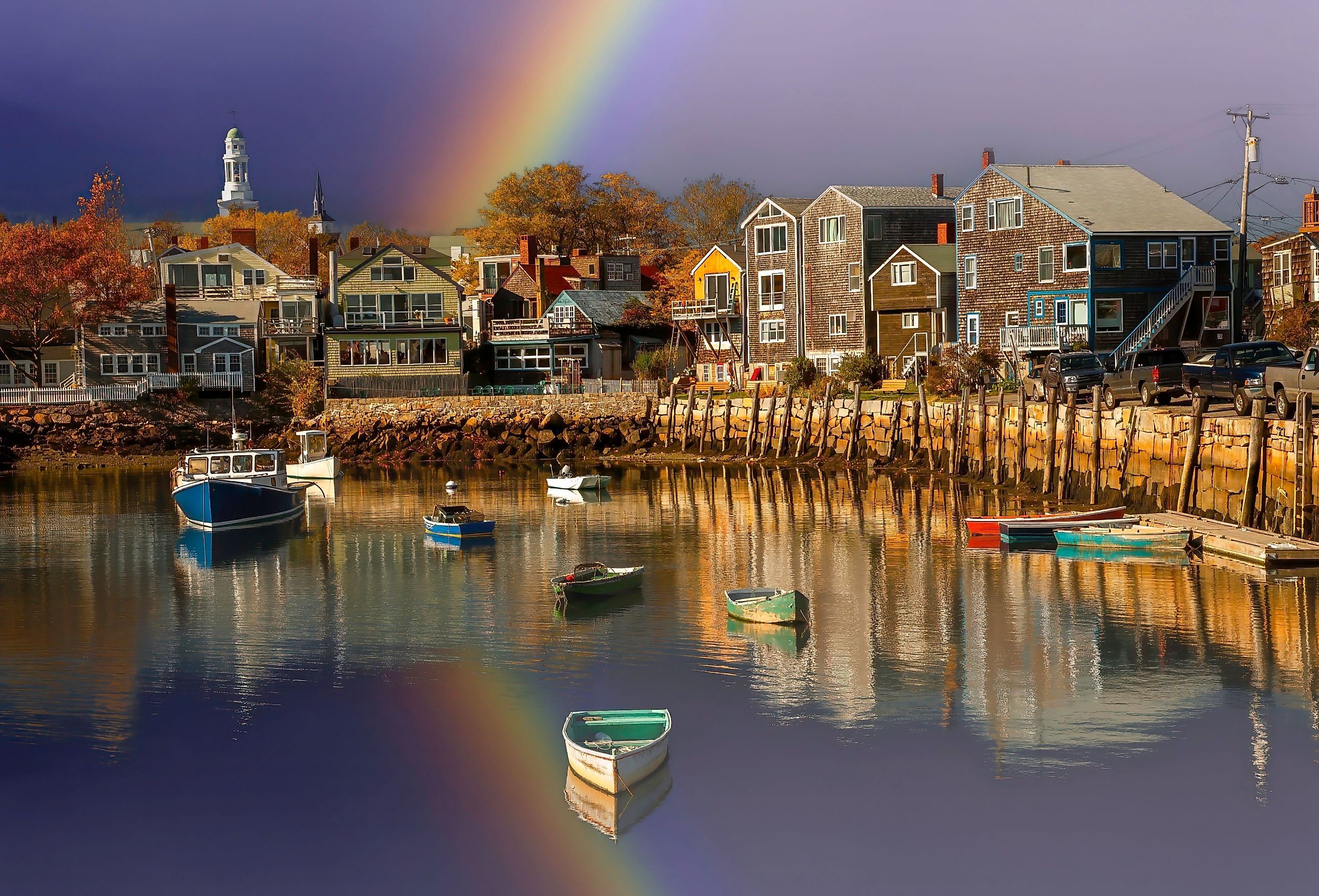 Fishing boat harbor at Rockport with rainbow in the background. Image credit Bob Pool via Shutterstock.