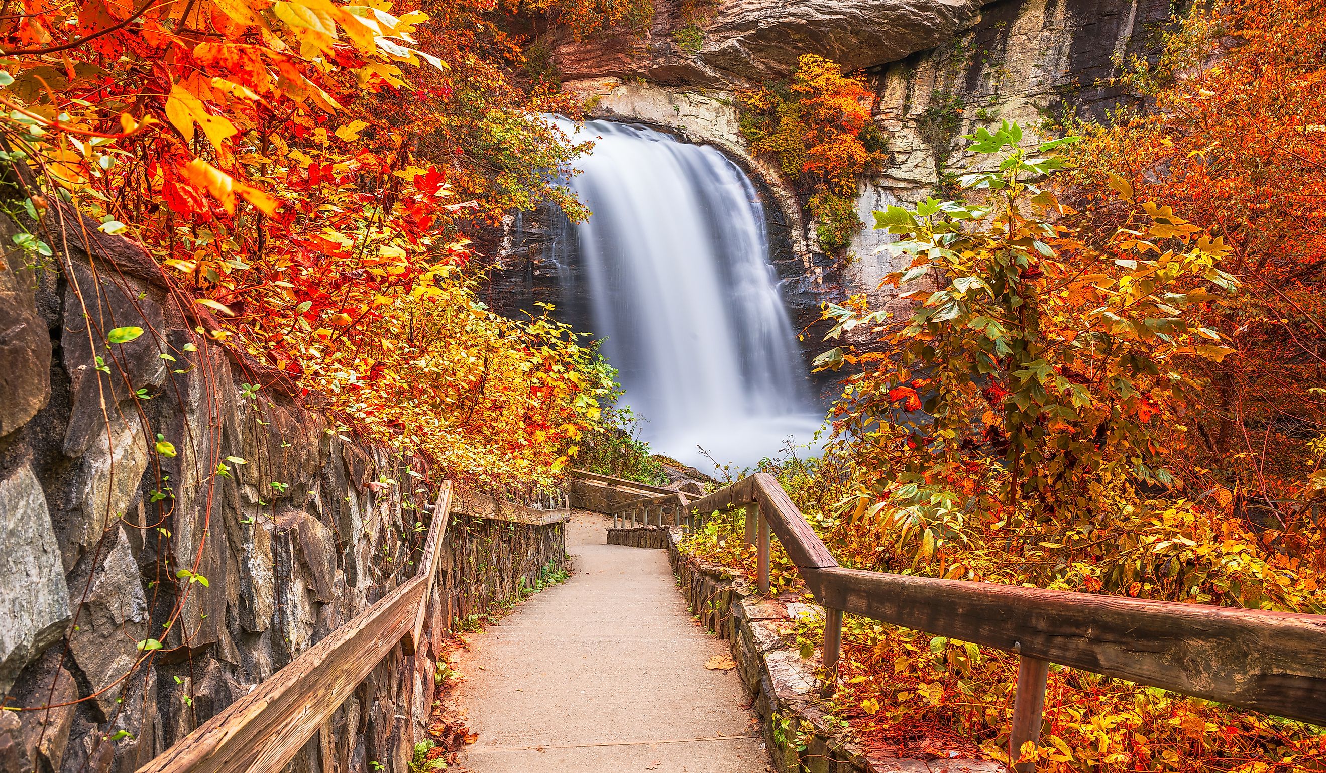 Looking Glass Falls in Pisgah National Forest, North Carolina, USA with early autumn foliage. 