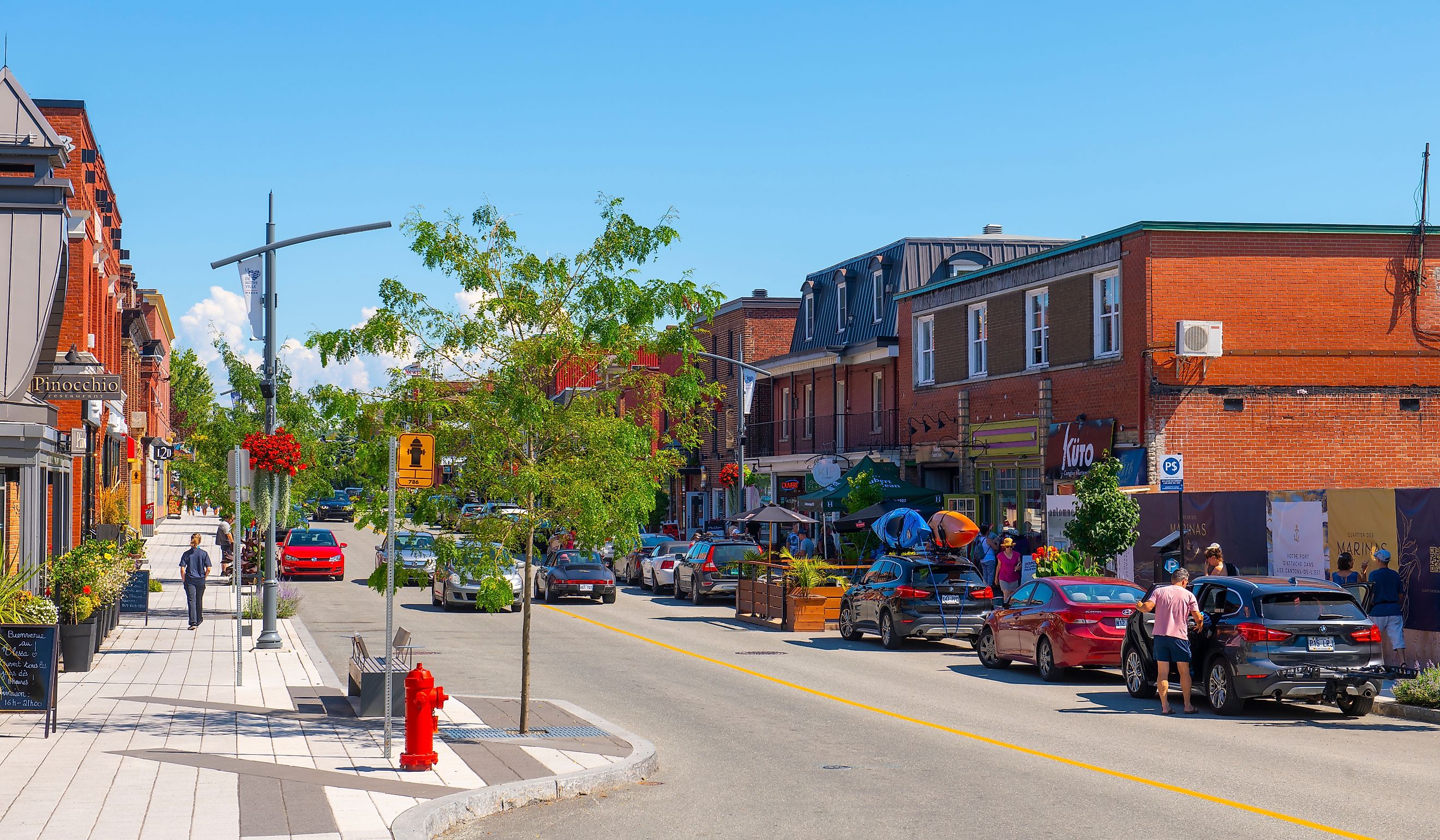 Historic commercial buildings on Rue Principale O Street in downtown Magog, Quebec QC, Canada. Editorial credit: Wangkun Jia / Shutterstock.com