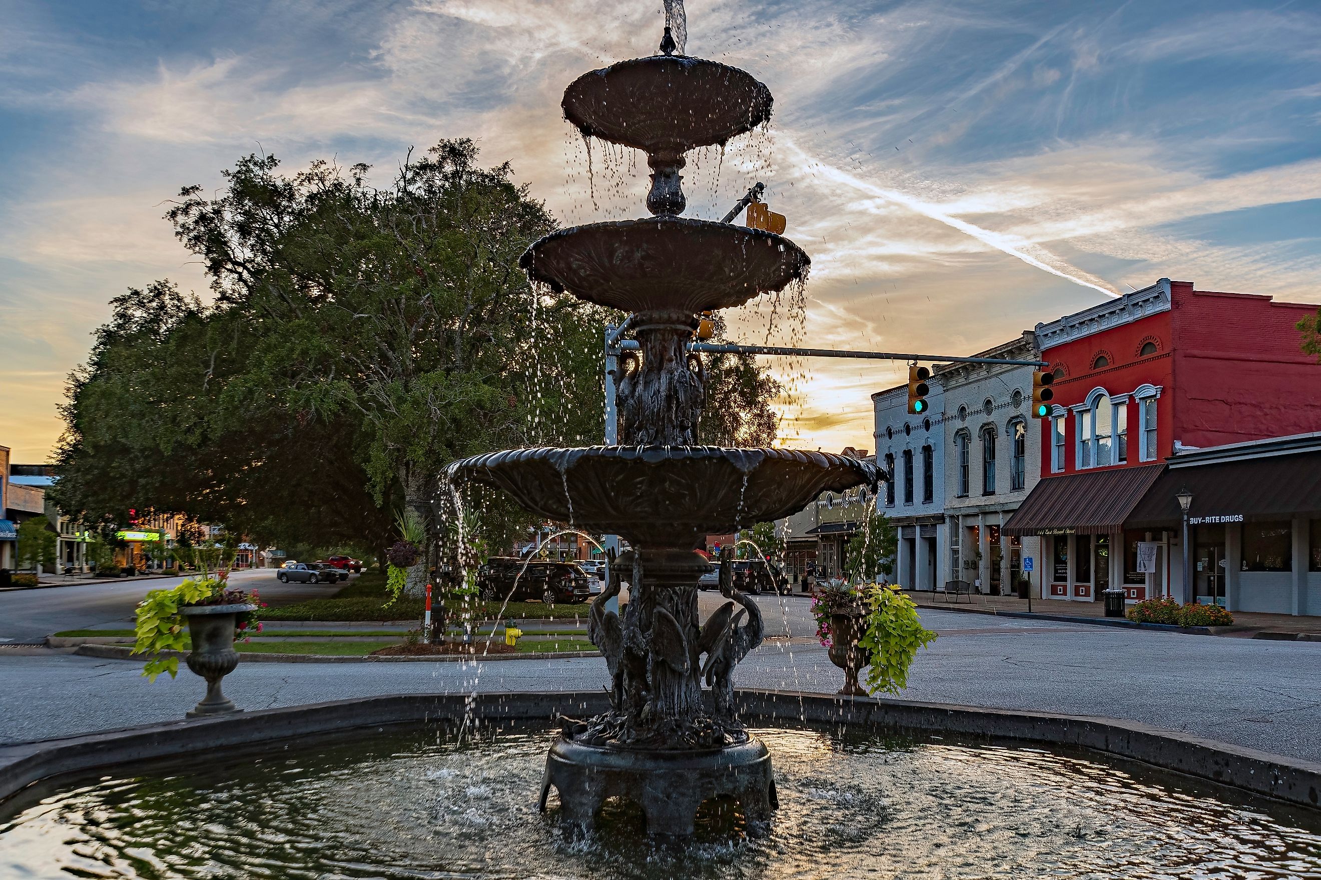 Low angle view of MacMonnie's Fountain, a three-tiered wrought iron structure purchased in 1880, in the downtown historic district of Eufaula, Alabama, at sunset. Editorial credit: JNix / Shutterstock.com