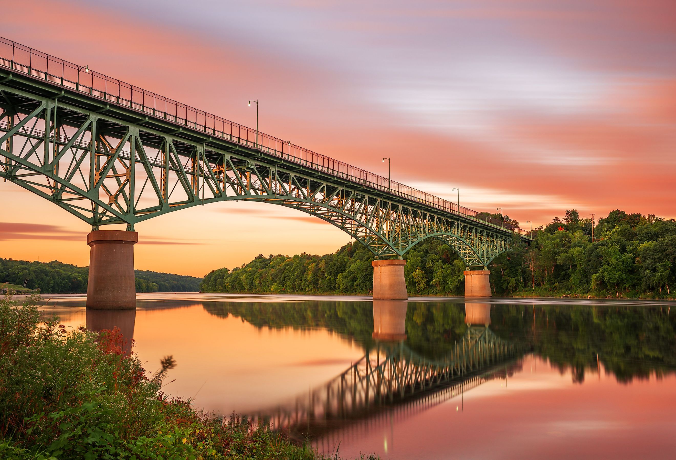 Augusta, Maine view on the Kennebec River with Memorial Bridge at dawn.