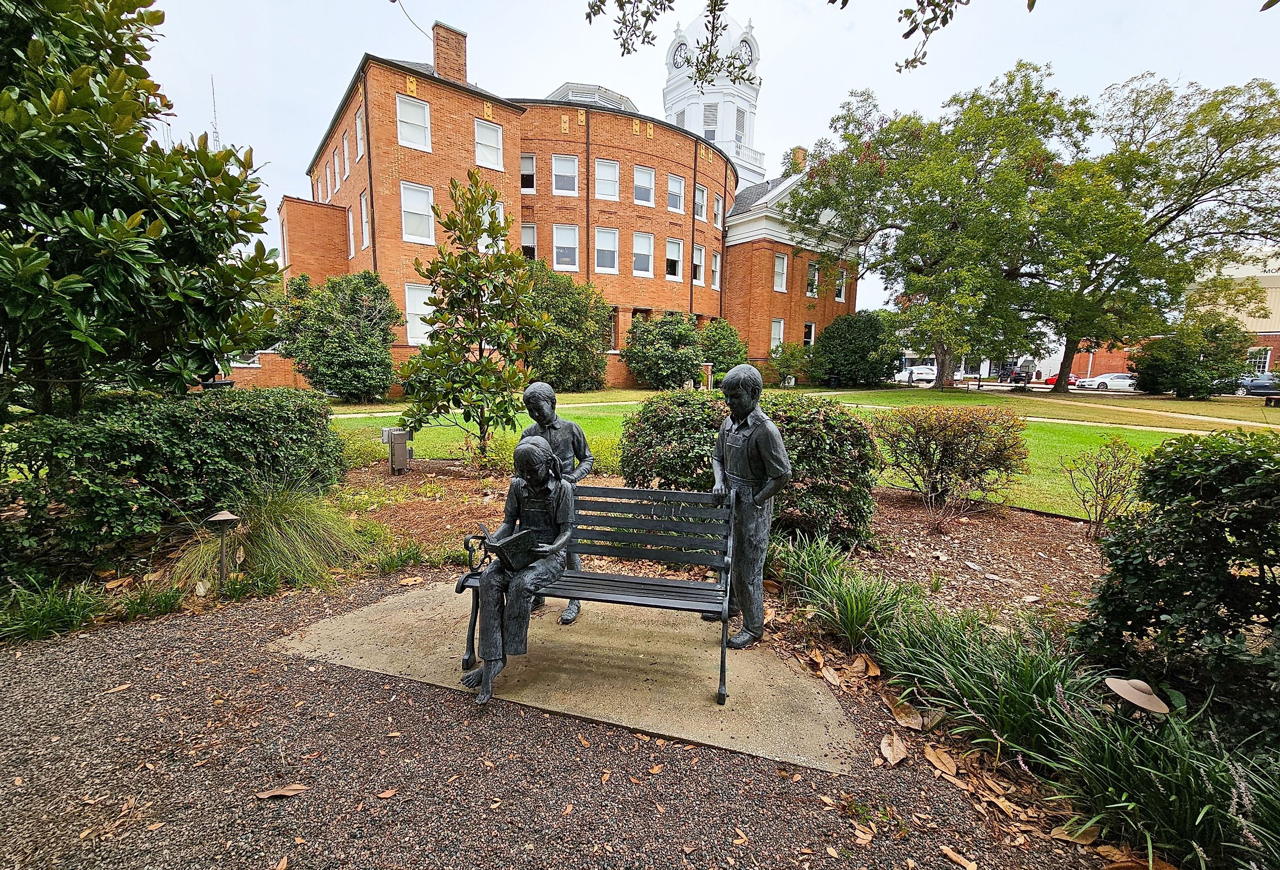 The "A Celebration of Reading Sculpture" by Branko Medencia that features the characters from Harper Lee's "To Kill a Mockingbird" in Monroeville, Alabama. Image credit VioletSkyAdventures via Shutterstock.