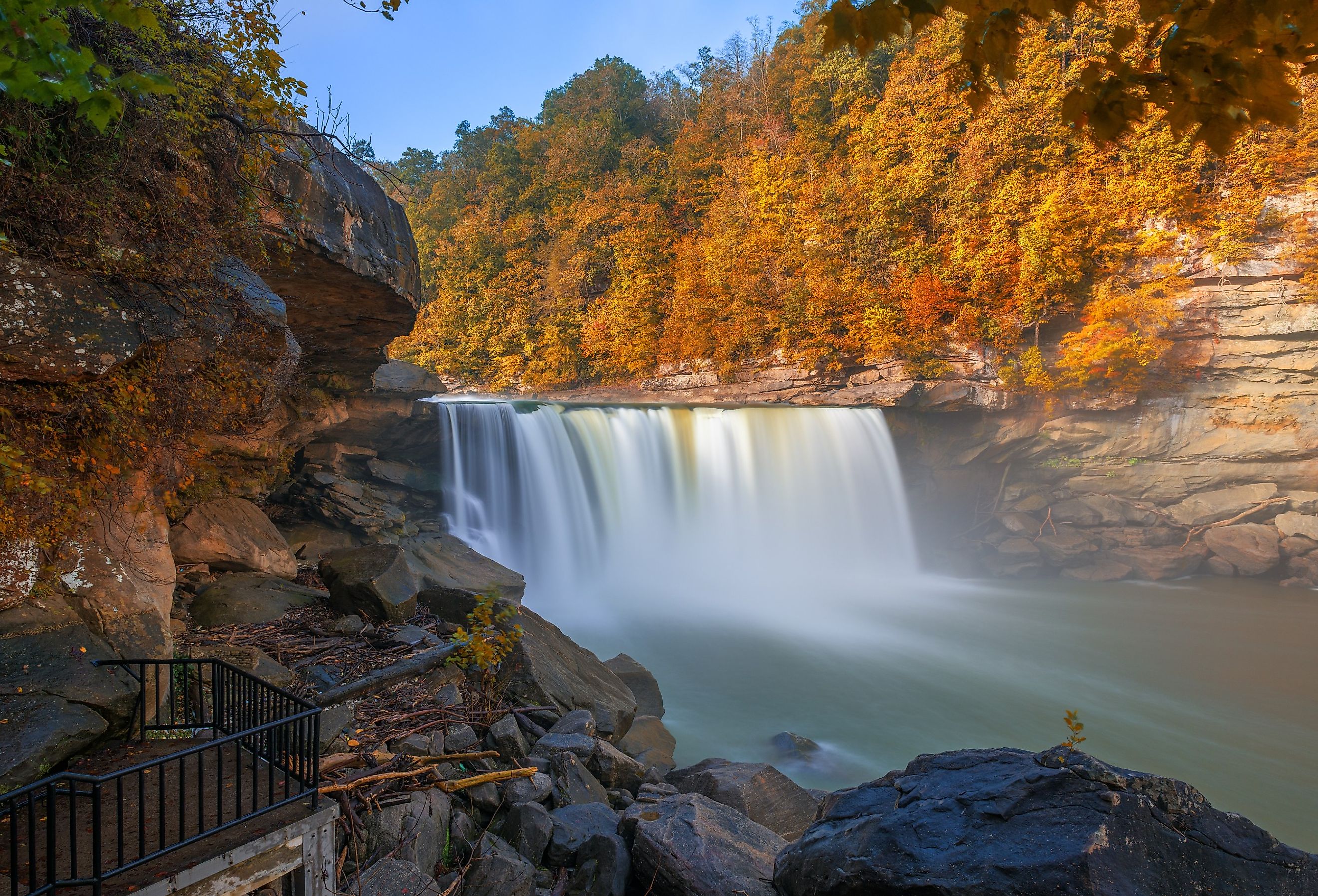 Cumberland Falls surrounded by autumn colors in Cumberland Falls State Resort Park, Kentucky.