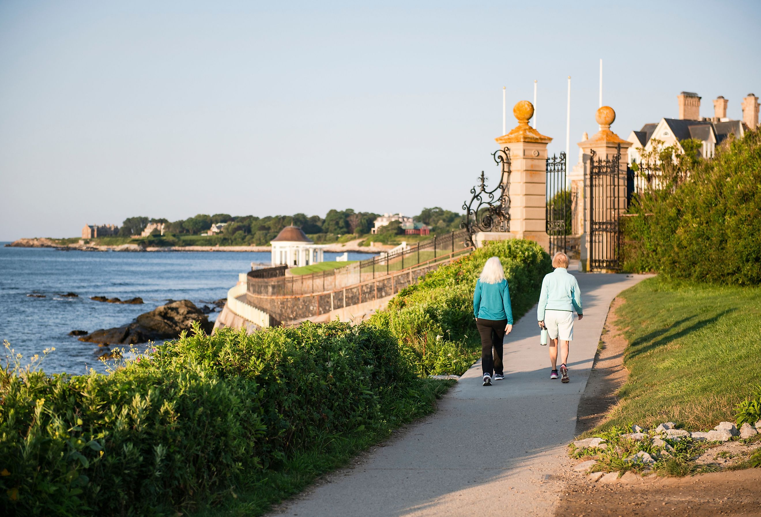 Older couple walking the public access path at Newport Cliff Walk, Rhode Island.