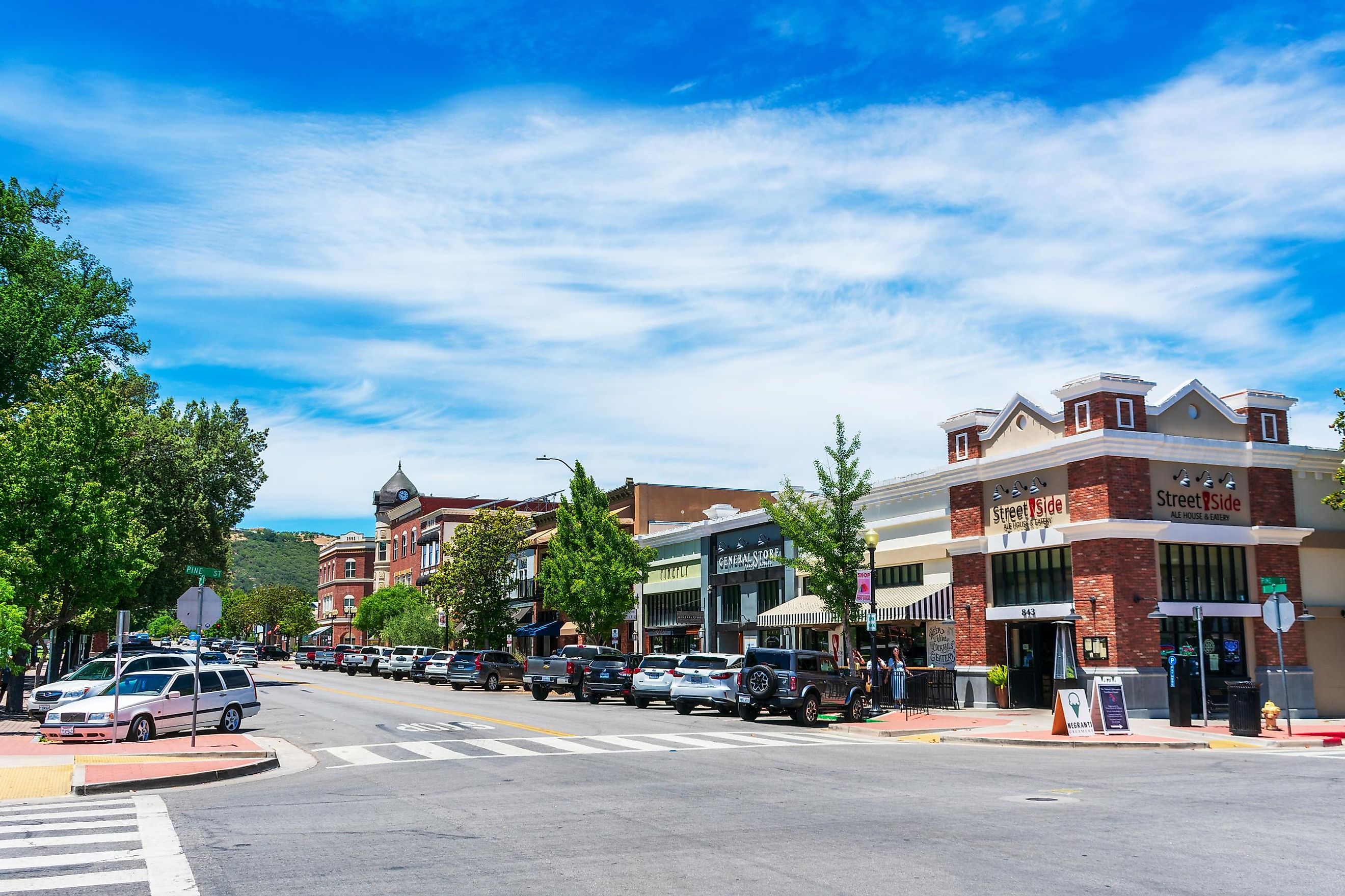 Cars parked in Downtown Paso Robles along 12th street with historic Clock Tower Acorn Building in background, via Michael Vi / Shutterstock.com