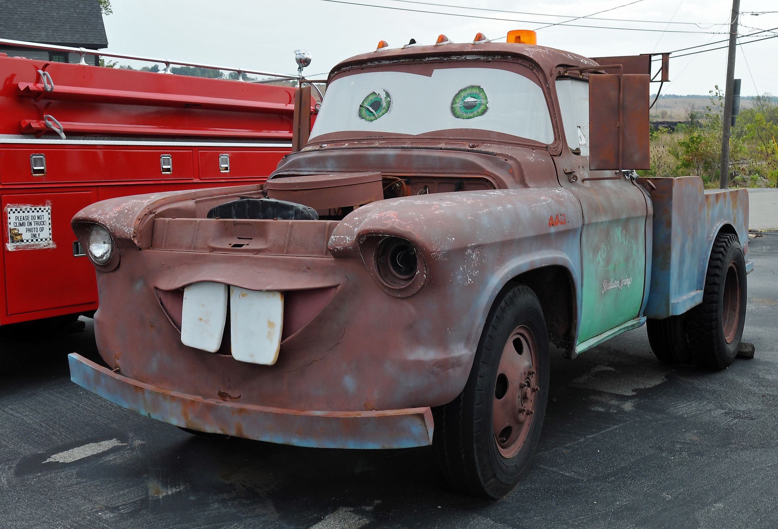 A replica of the animated Cars character Tow Mater is parked at the former Kan-O-Tex service station on Route 66 in Galena, Kansas.Editorial Credit: BD Images / shutterstock.com